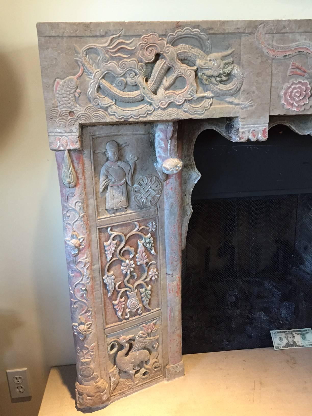 Here's one of the most beautiful Chinese antiques we have ever found in our travels in China over the past three decades.

This is a one-of-a-kind antique sandstone fireplace surround/mantle and dates to the 18th century of the Qing dynasty. 

It