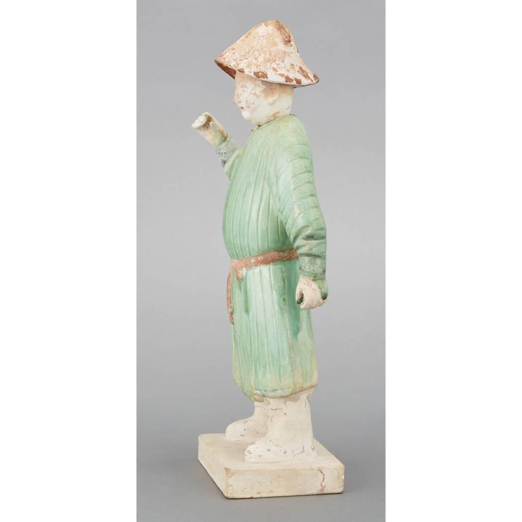 China, an ancient, handsome and beautifully glazed pottery groom, terracotta, measures: 28cm, 11