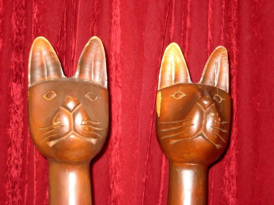 tall wooden carved cats