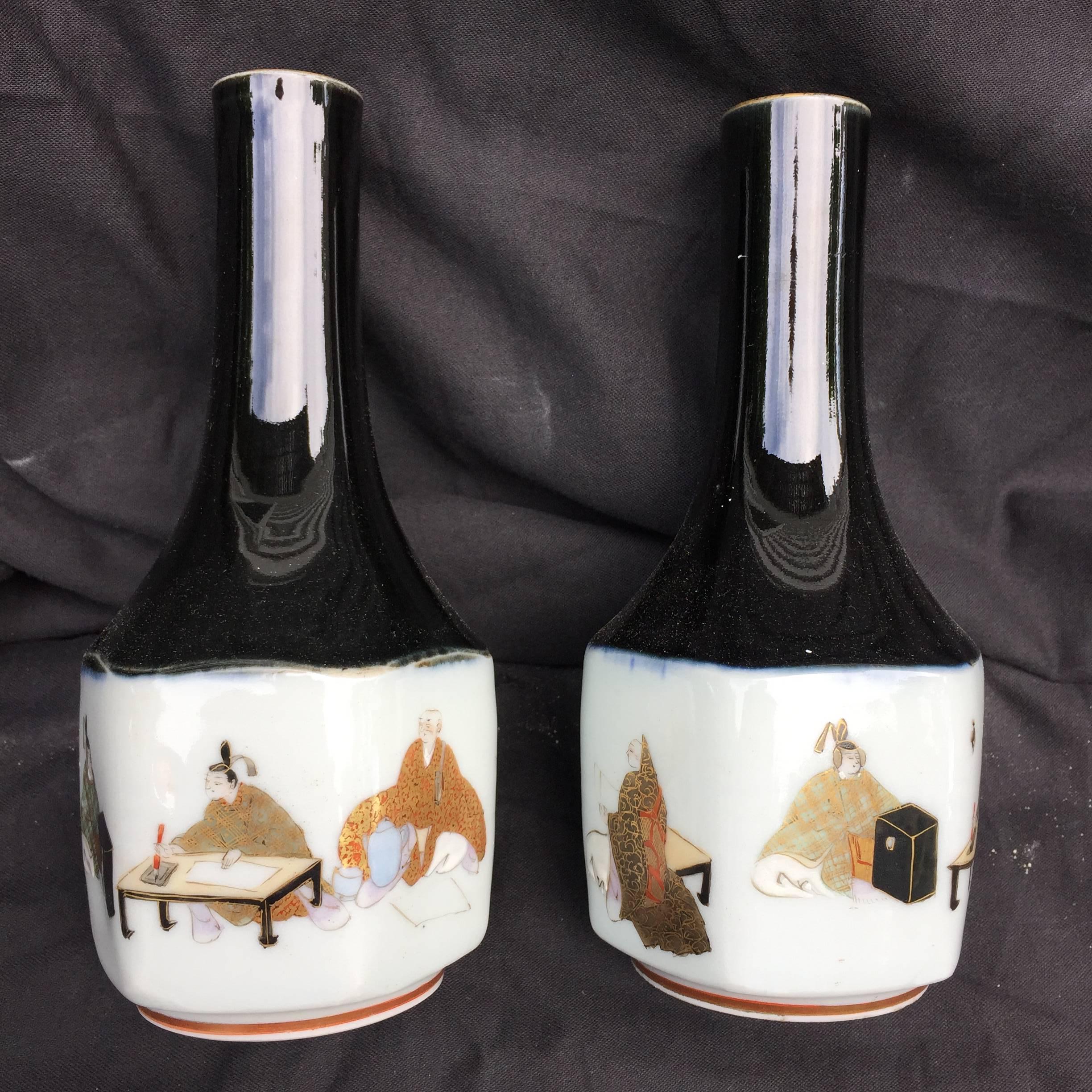 Here's a wonderful pair of Japanese hand-painted porcelain sake bottles dating to the 19th century. Notice the superb detail and gilding paintings of each cameo by the artist! Kutani kiln. Unimprovable.

Dimensions: 6