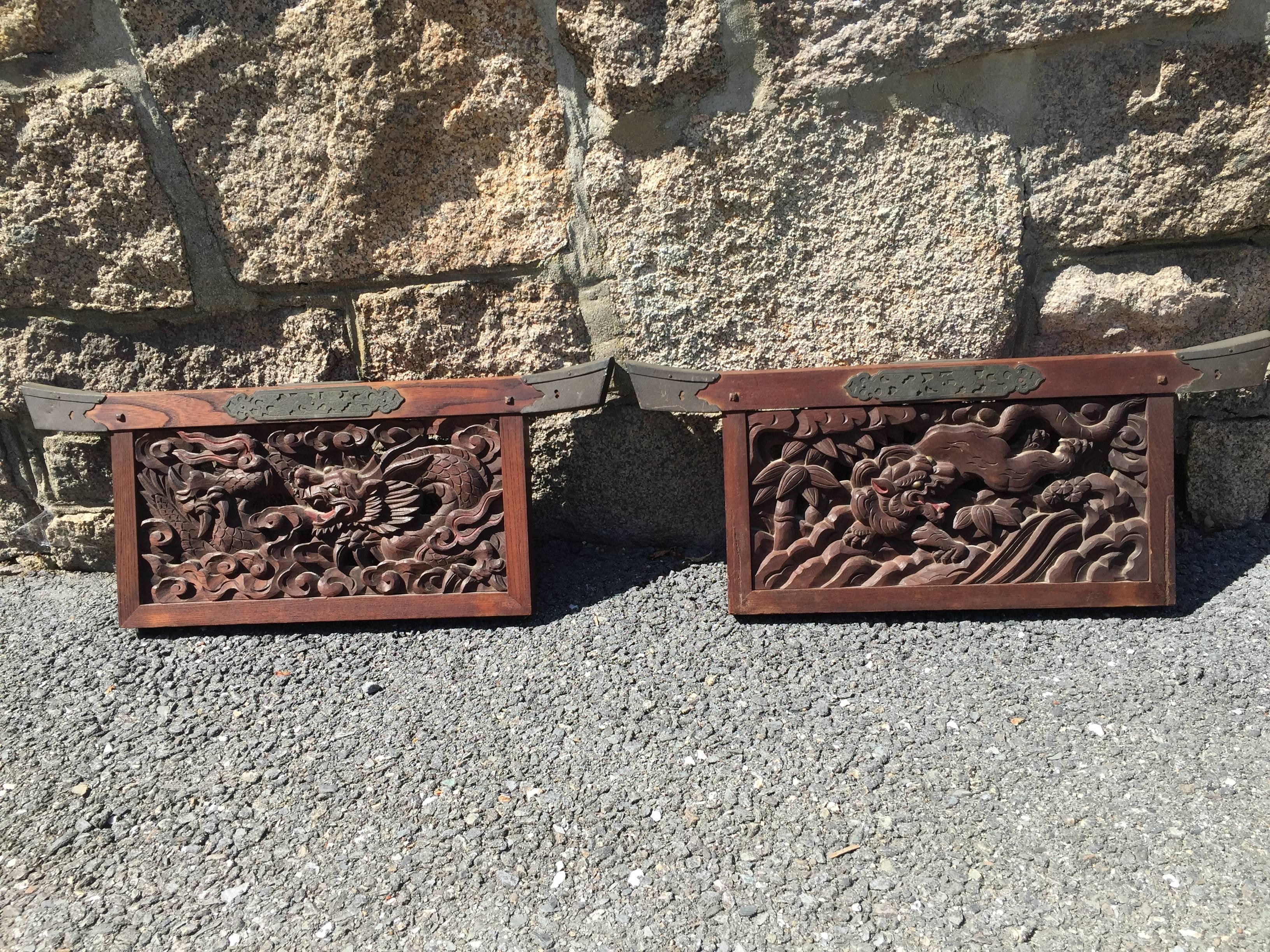 Japan, a one of a kind pair of Torii form Shinto Shrine hand-carved wooden Dragon and Tiger Temple wall ornaments, Taisho period (1912-1926)

Dimensions: 11 inches high and 28 inches wide

Fine quality replete with glass eyes for dragon and tiger