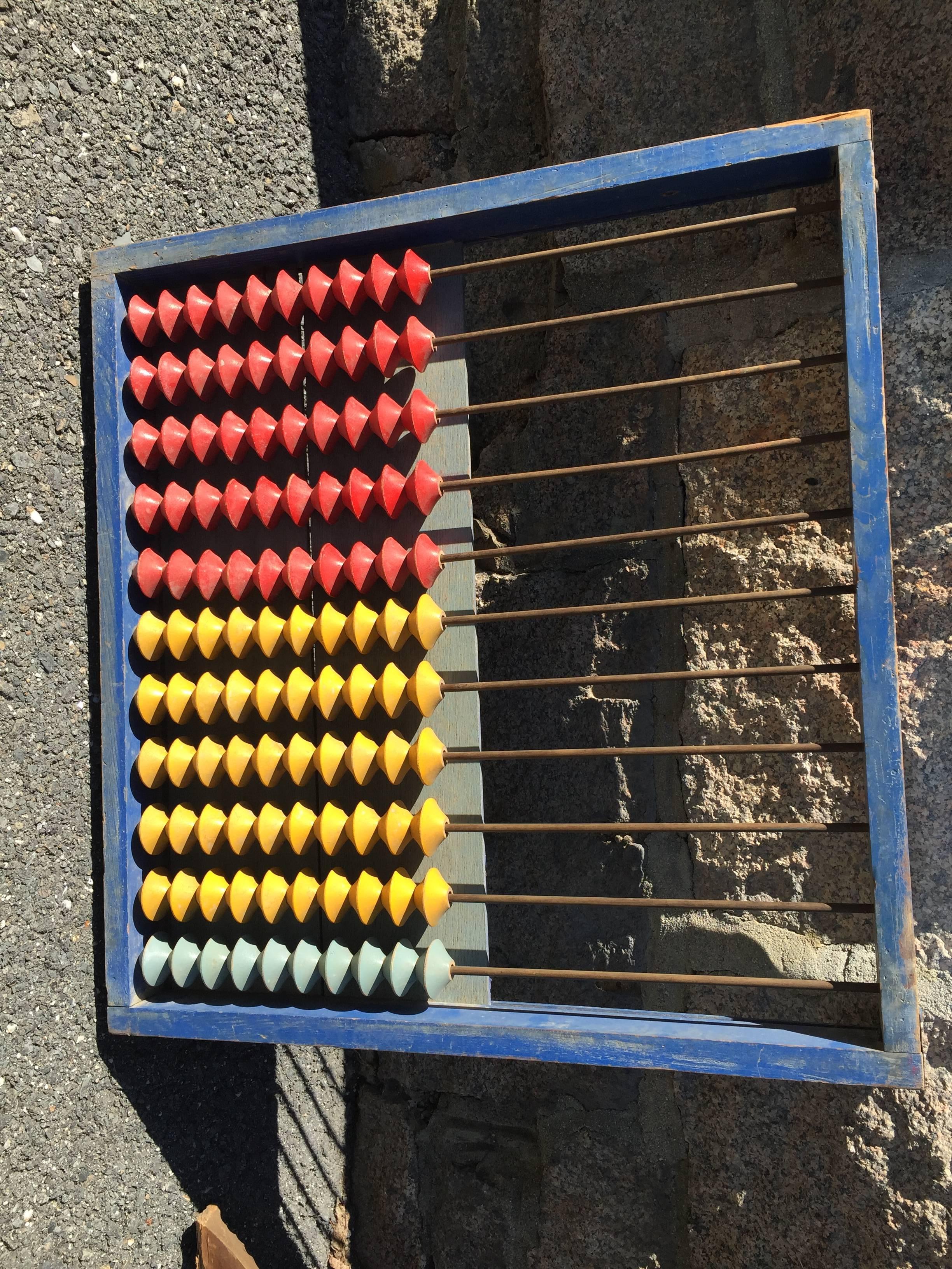 A colorful hand made children's school antique abacus Soroban from old Japan, 1950s in brilliant red, blue and yellow colors. Mount it on your wall or use it to teach with- it still works!

Dimensions: 24 inches high and 25 inches wide.

Includes