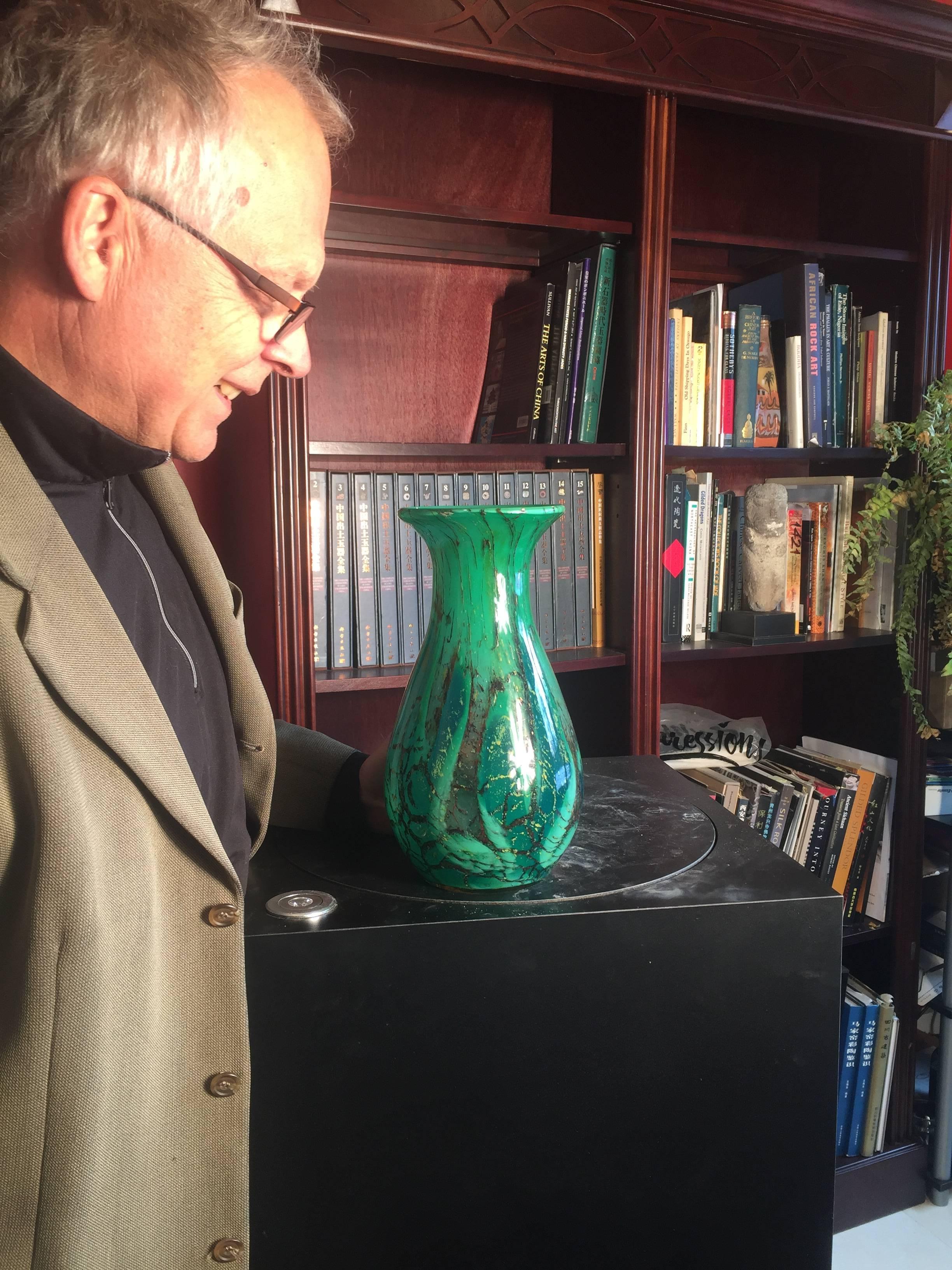 FEBRUARY SALE - NOW SAVE 25% AND MORE

A large and stunning hand crafted glass vase by WMF Ikora, superbly rendered in rich greens with yellow and red inclusions, Karl Wiedmann designer, circa 1935.

Dimensions: Tall 12 inches high and 6 inches