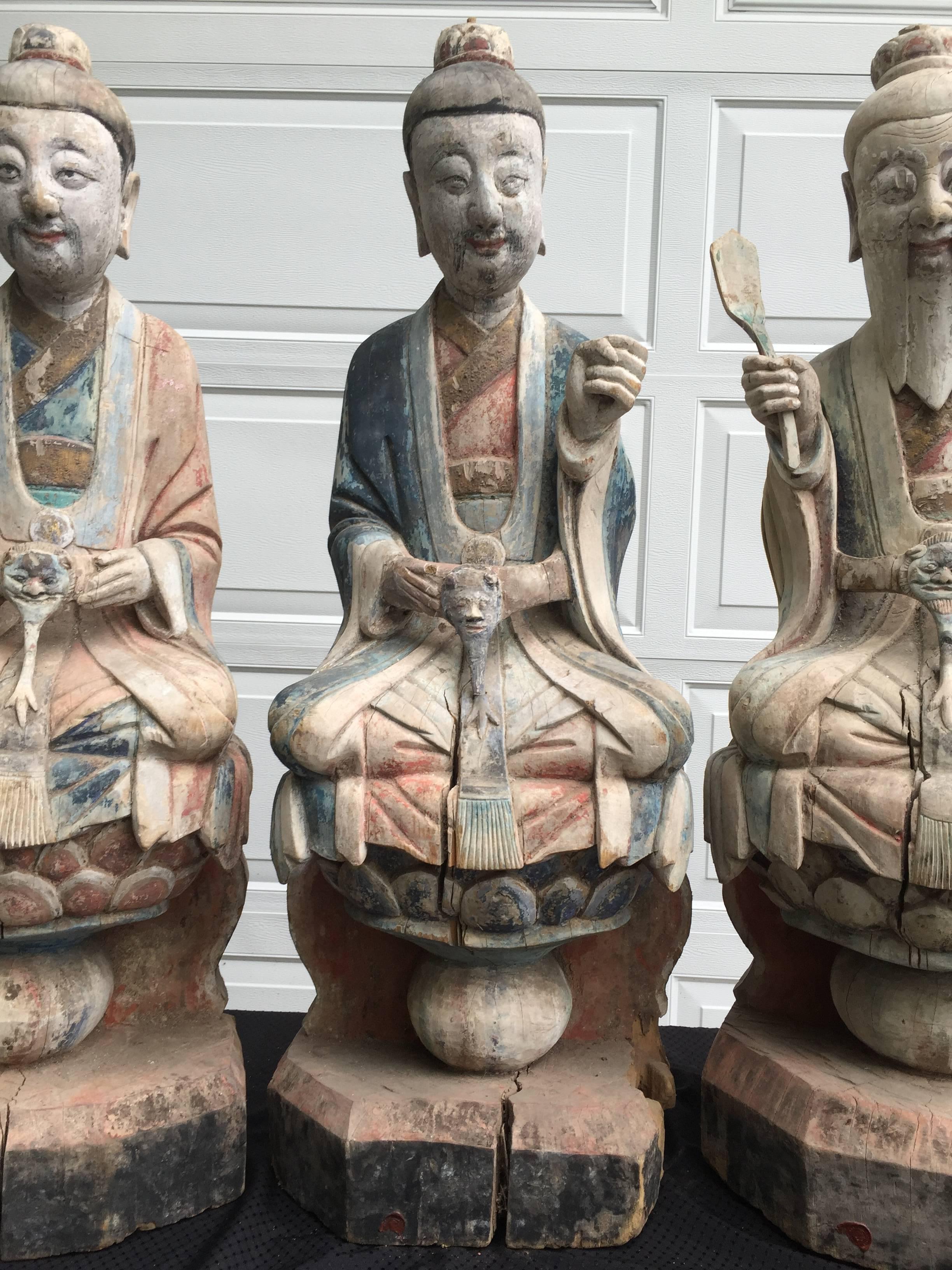 three pure ones statues