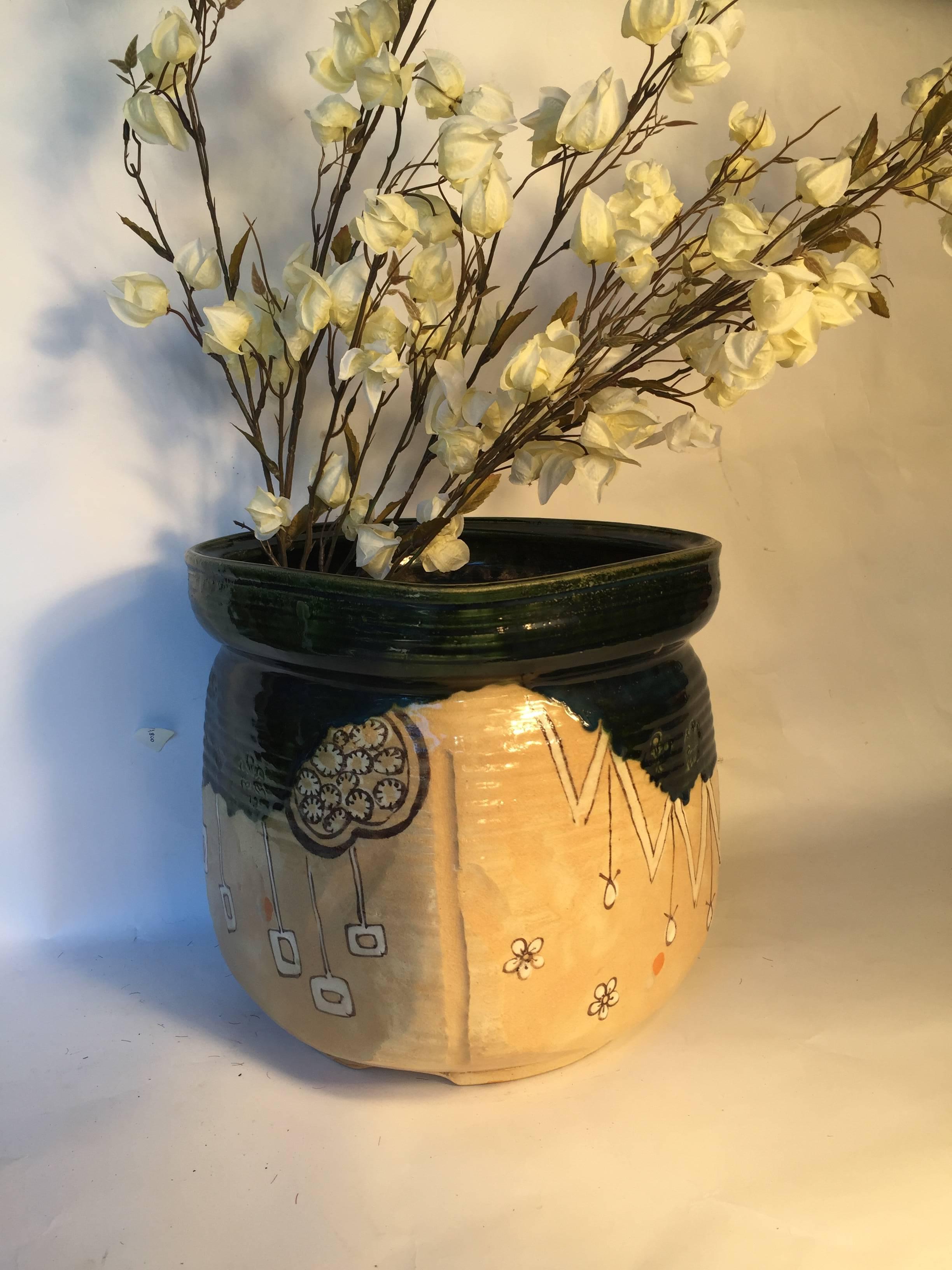 Mint, Signed and Boxed

A superb large scale Japanese ikebana planter crafted in a beautiful glazed green, black and white ceramic organic floral pattern. Artisan signed. Complete with Hinoki wood tomobako collector box. 

Hand made and hand