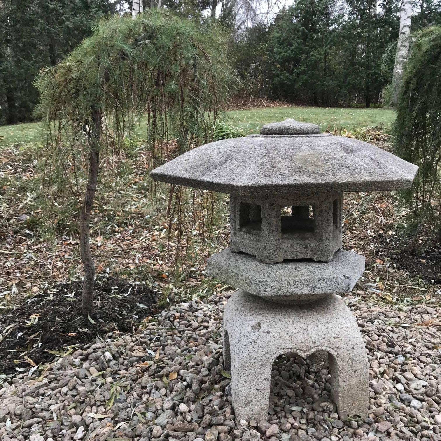 Japan a large hand carved “Yukimi” granite stone lantern (also known as a snow lantern because of its broad roof), four pieces, 

Dimensions: 34 inches high and 34 inches wide

Period:  Meiji period, 19th century

Quality:  A beautiful example
