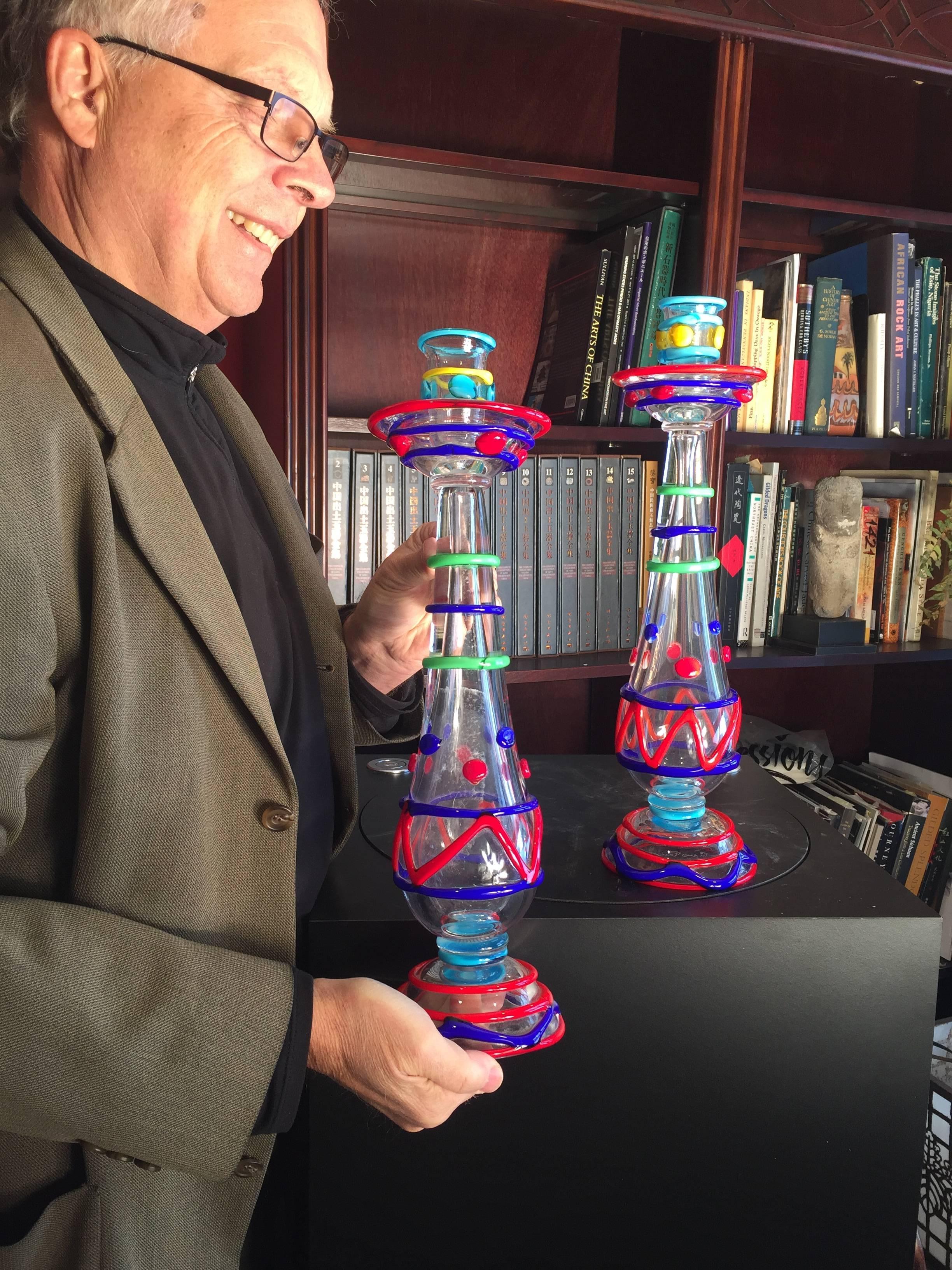 Italy, Murano hand blown, brilliant colors pair two candlesticks signed label master Eugenio Ferro, about 1950, 

Dimensions:  Tall 18 inches high 

Quality:  Excellent condition. Gorgeous pair

Hand made and hand blown 

This is a one-of-a-kind