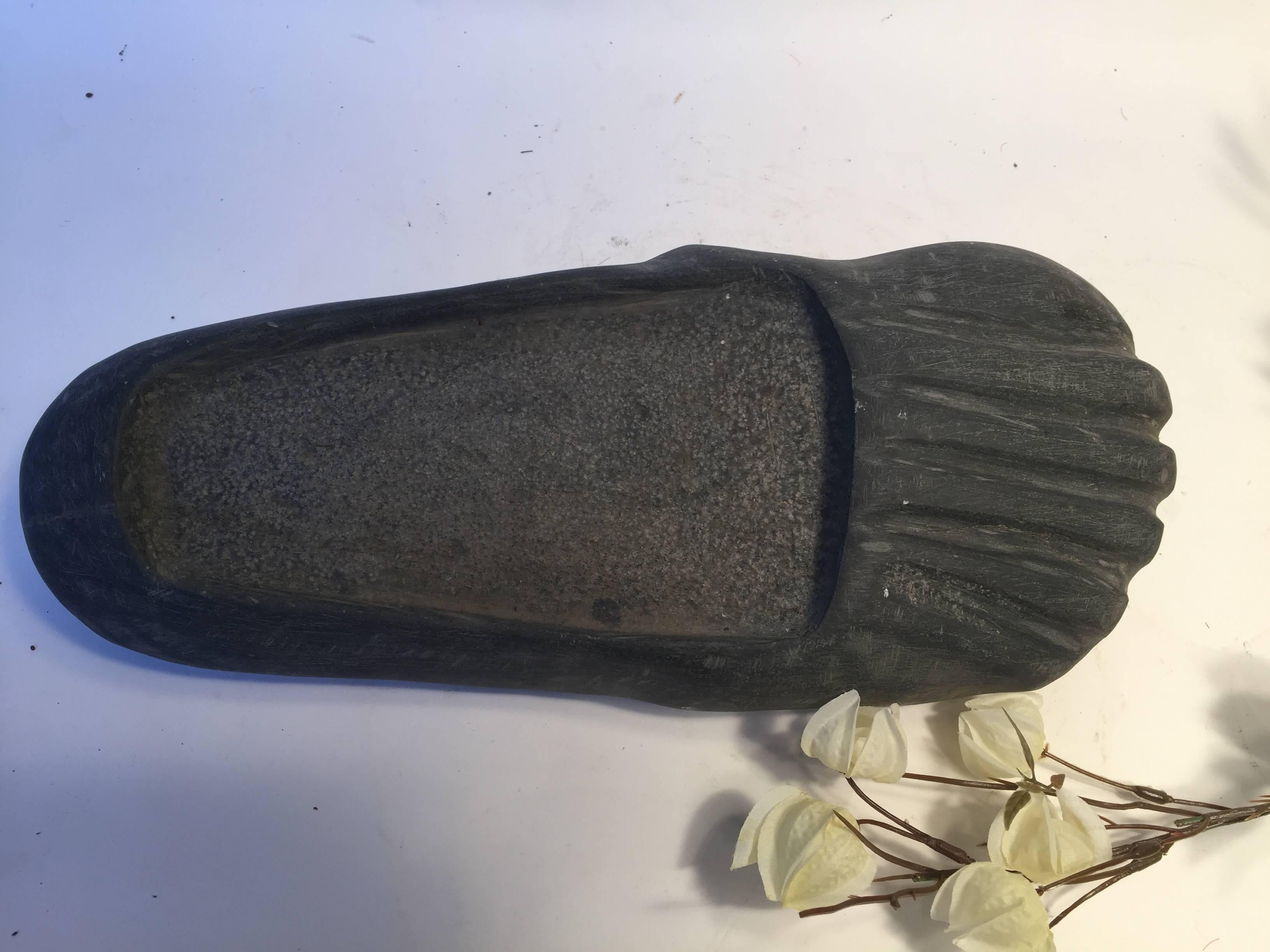 This is a beautiful and novel little treasure carved in stone. This Buddha foot carving in dark limestone was acquired for our private collection in western China some 15 years ago. It was originally carved in China's Chengdu area. 

Our Buddha's