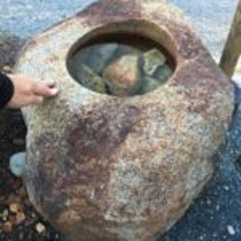 A genuine rarity, this fine large sized old hand-carved solid granite stone water or plant basin in a rustic style, is hand caved from a rare red colored (iron rich) granite stone called kurama stone. This rare stone once mined in northern Kyoto, is
