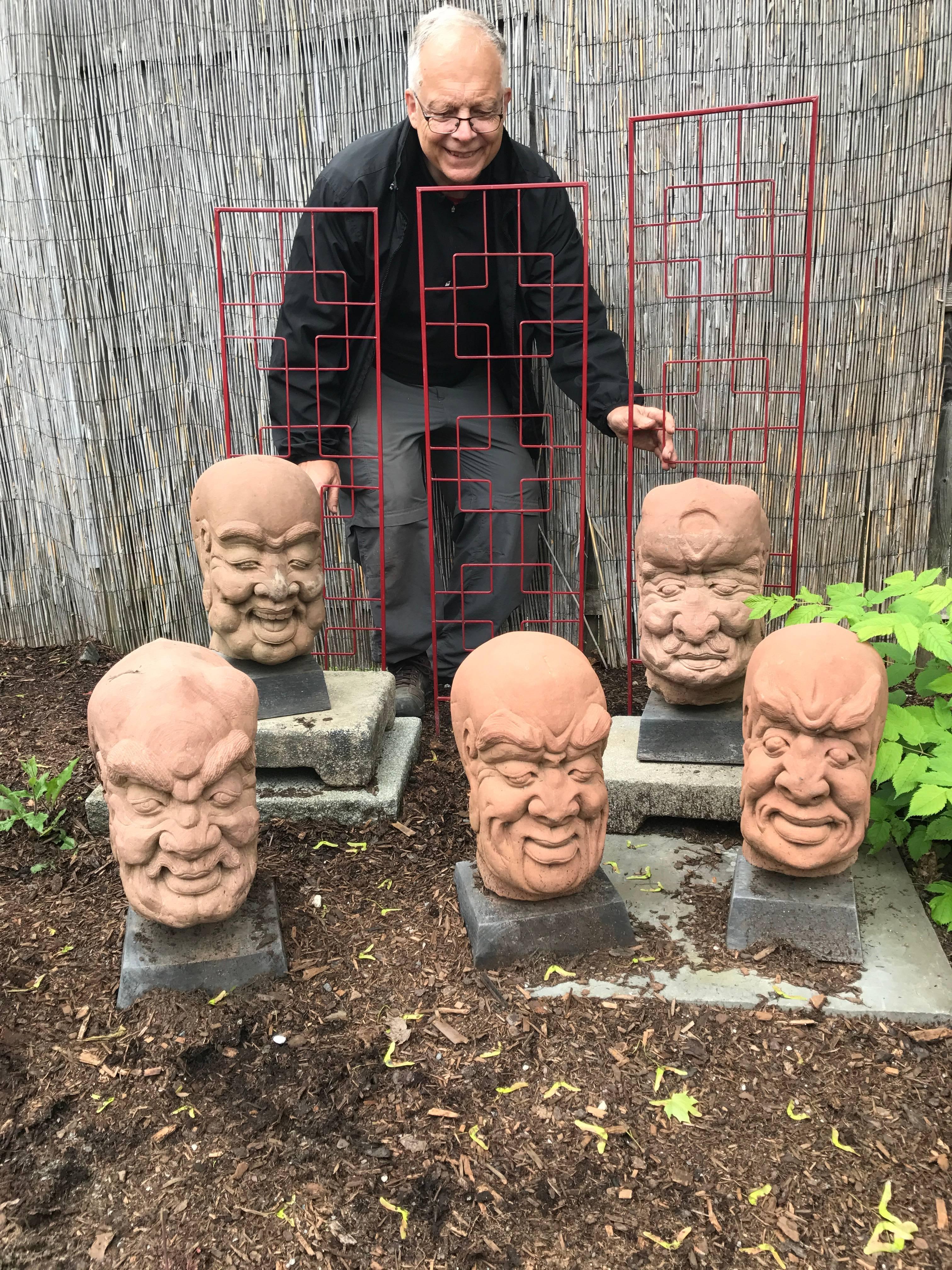 Instant collection, one of a kind.

From western China and collected some 20 years ago, comes this group of five (5) large hand carved red sandstone Lohans or Monks dating to the 19th century. 

These characters feature fantastic and exaggerated