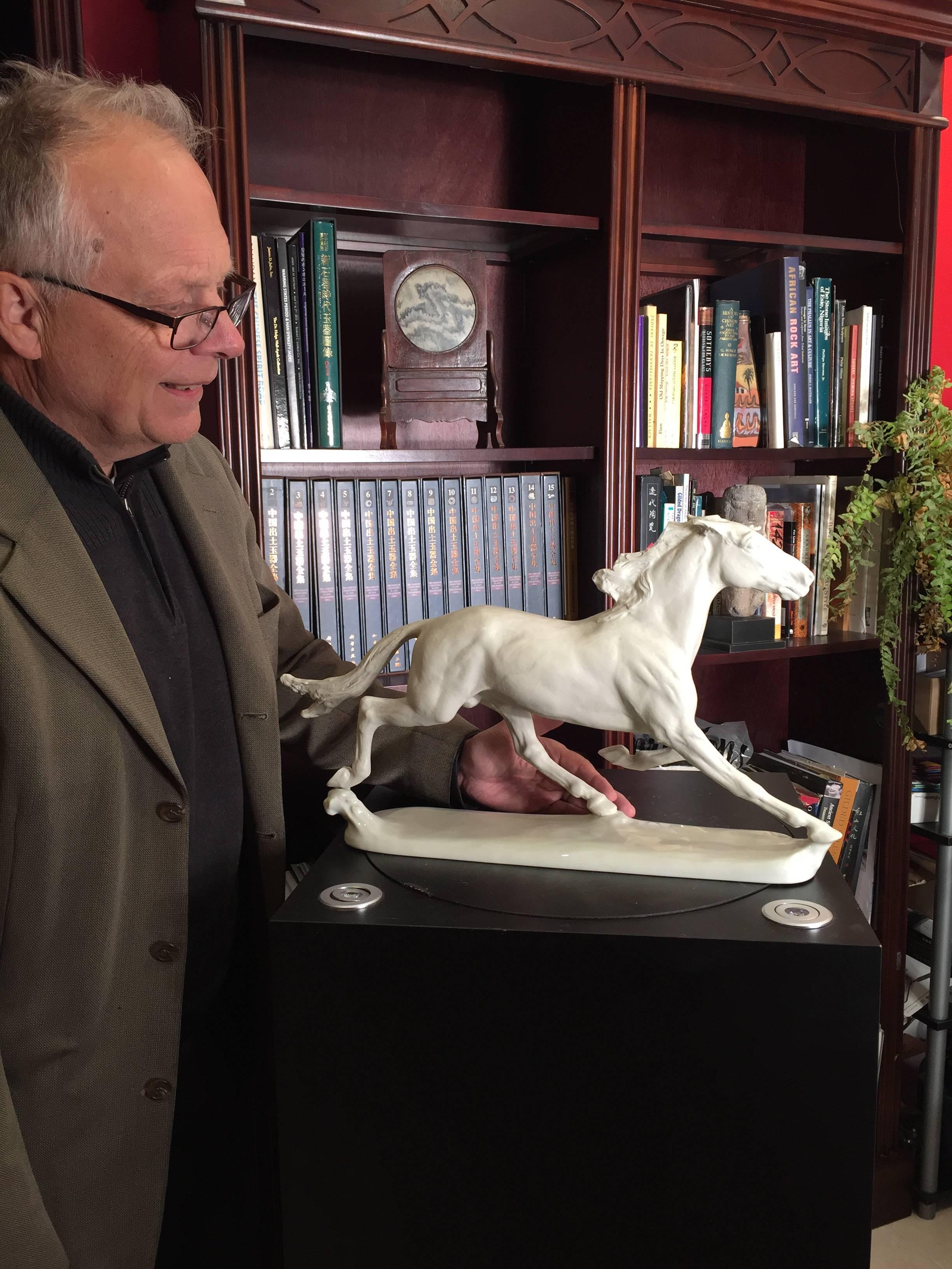 An early larger scale efffigy of an animated, galloping horse, pure white porcelain effigy depicted on a glazed porcelain base. 

Handmade and signed

Dimensions: 13 inches high and 21 inches in length and 4.5 inches depth, signed Hussman design for