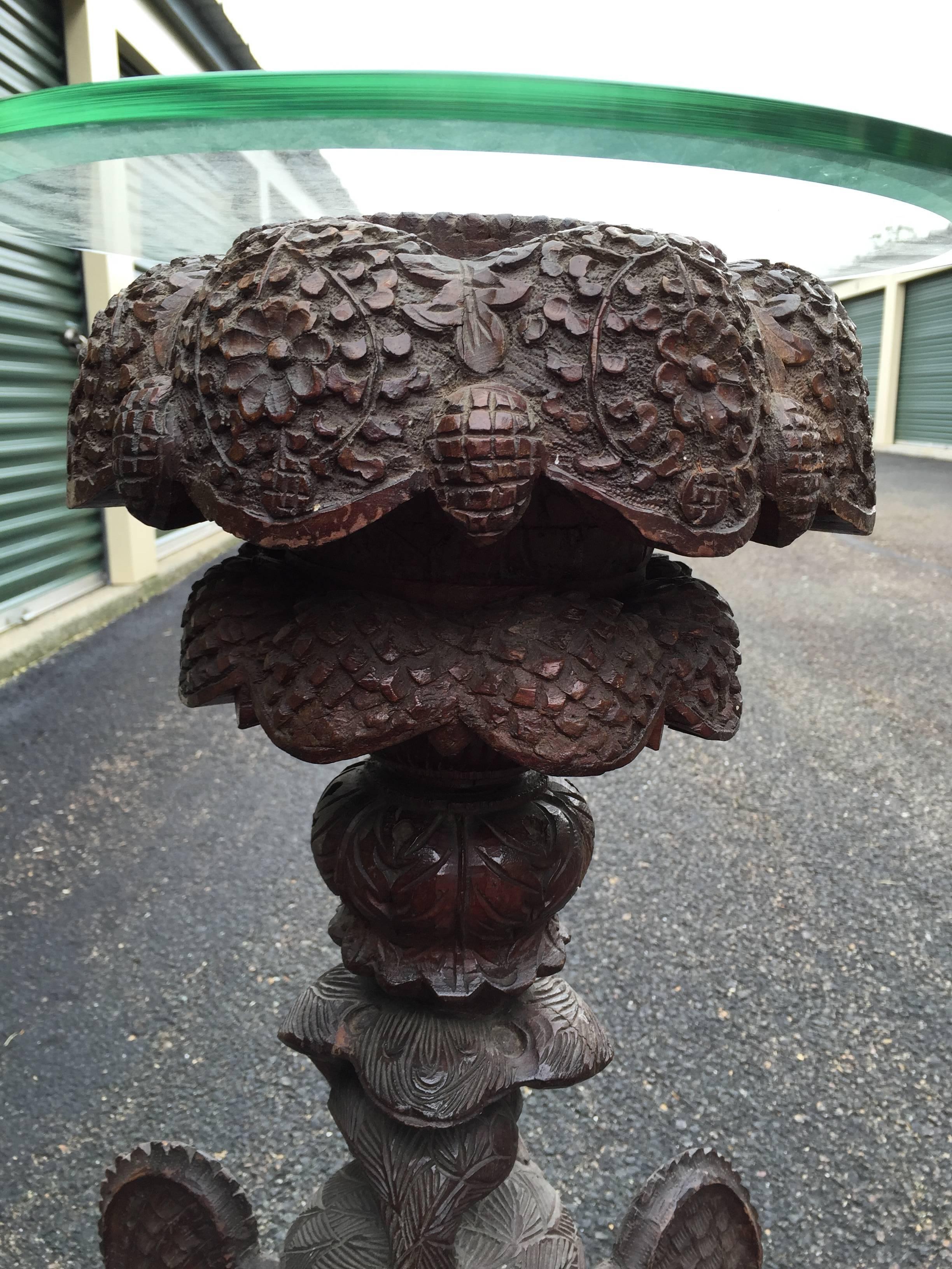 A highly decorative and hard to find Anglo-Indian finely carved and pierced teak wood flower stand  with prolific floriate and wild life design.

Period: Circa 1860-1880, likely carved from the Bombay, India region.

Dimensions: 45 inches high and
