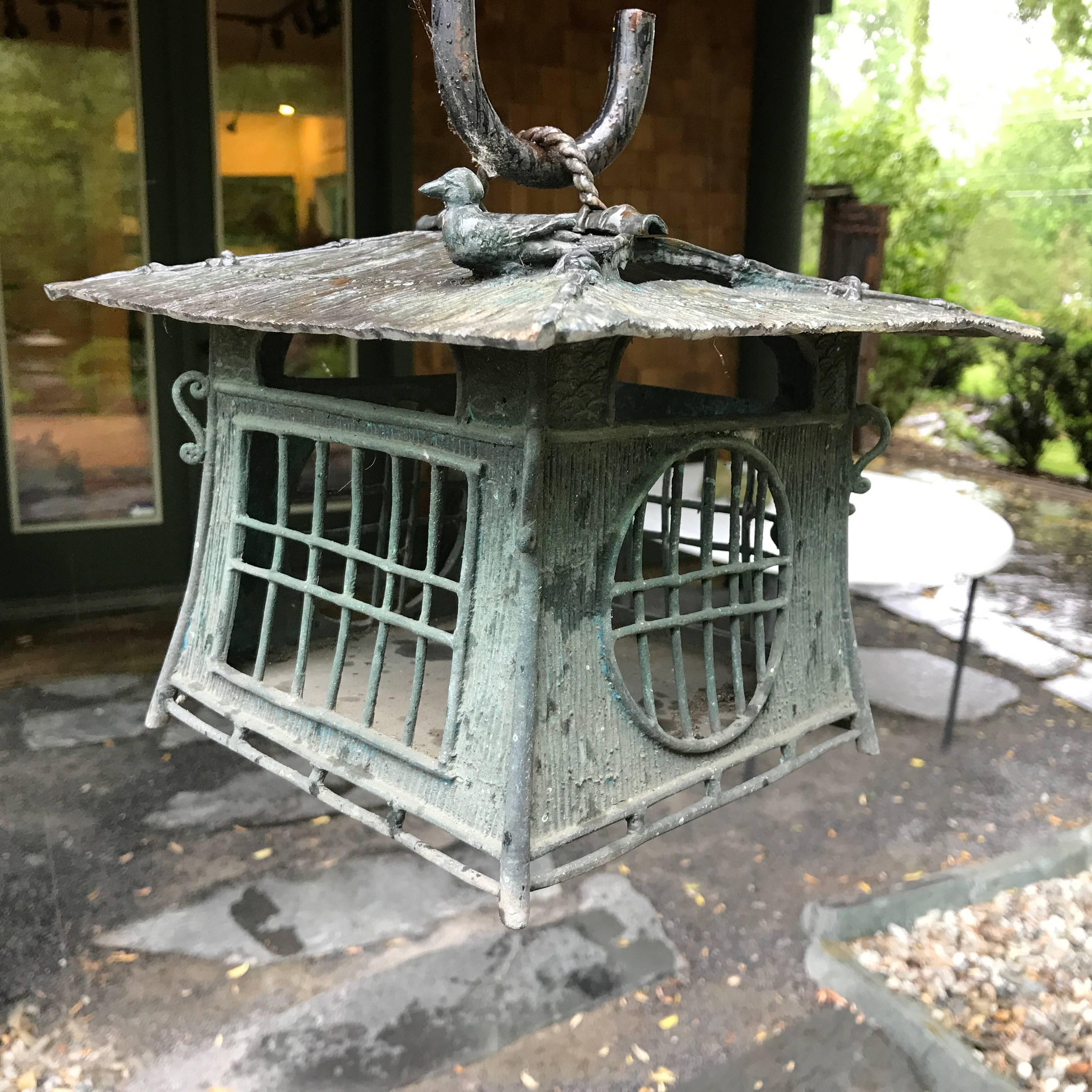Here's a beautiful and unique way to accent your indoor or outdoor garden space with this treasure from Japan!

This is a bronze casting of a wonderful lantern with a Bird on the Roof design. Door fully operational to insert wax, tea, or oil