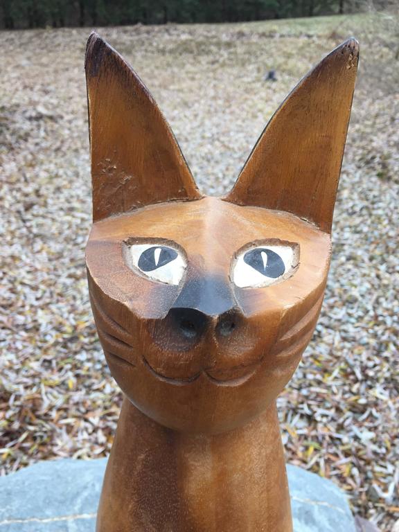 tall wooden carved cats