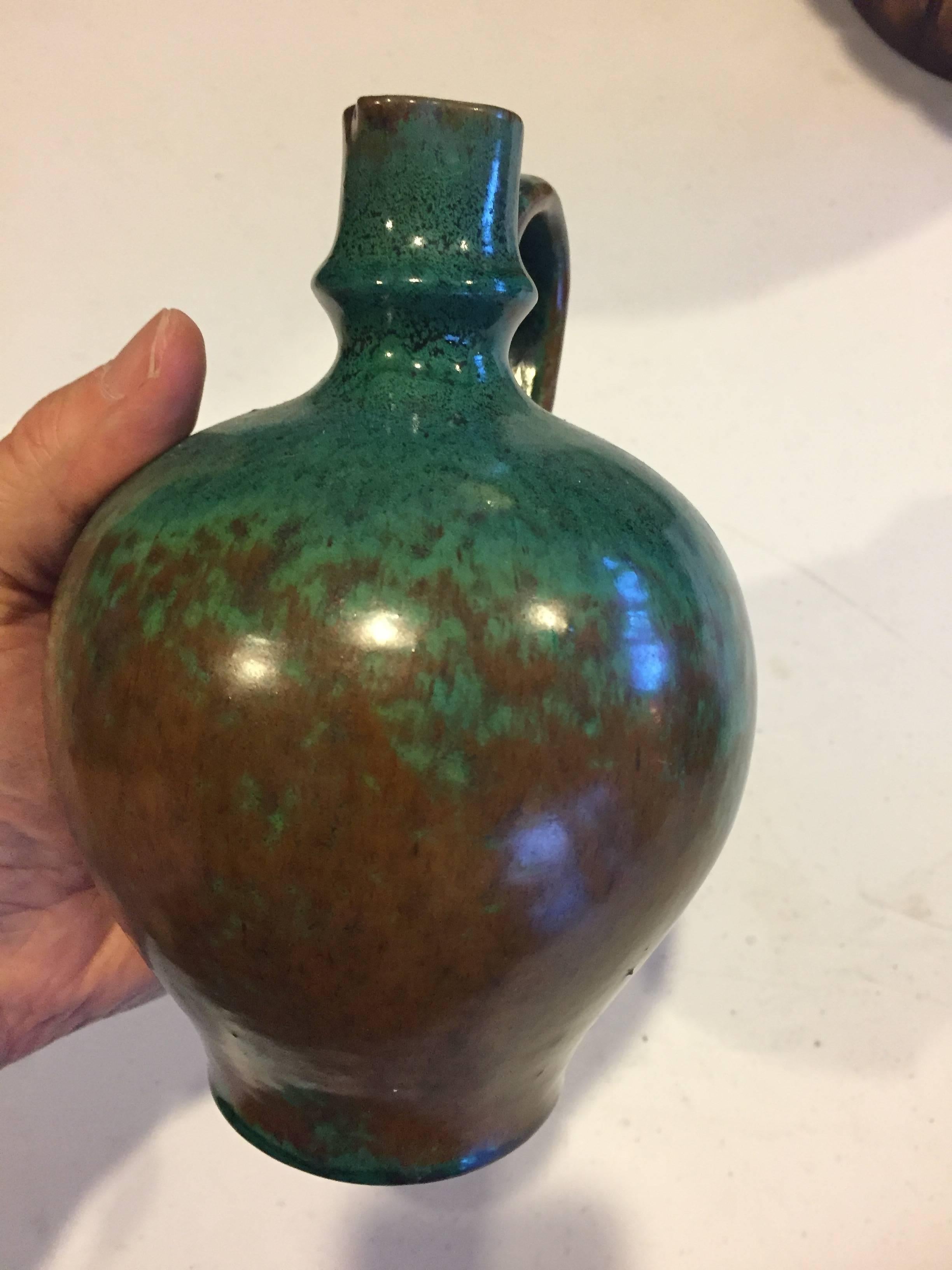 FEBRUARY SALE - NOW SAVE 25% AND MORE

Designer's source

Desireable early contemporary Pitcher Vase created in a stunning bluish green handmade and hand glazed finish by Paul Dresler, circa 1930

Fine original condition. 
Designer: Paul