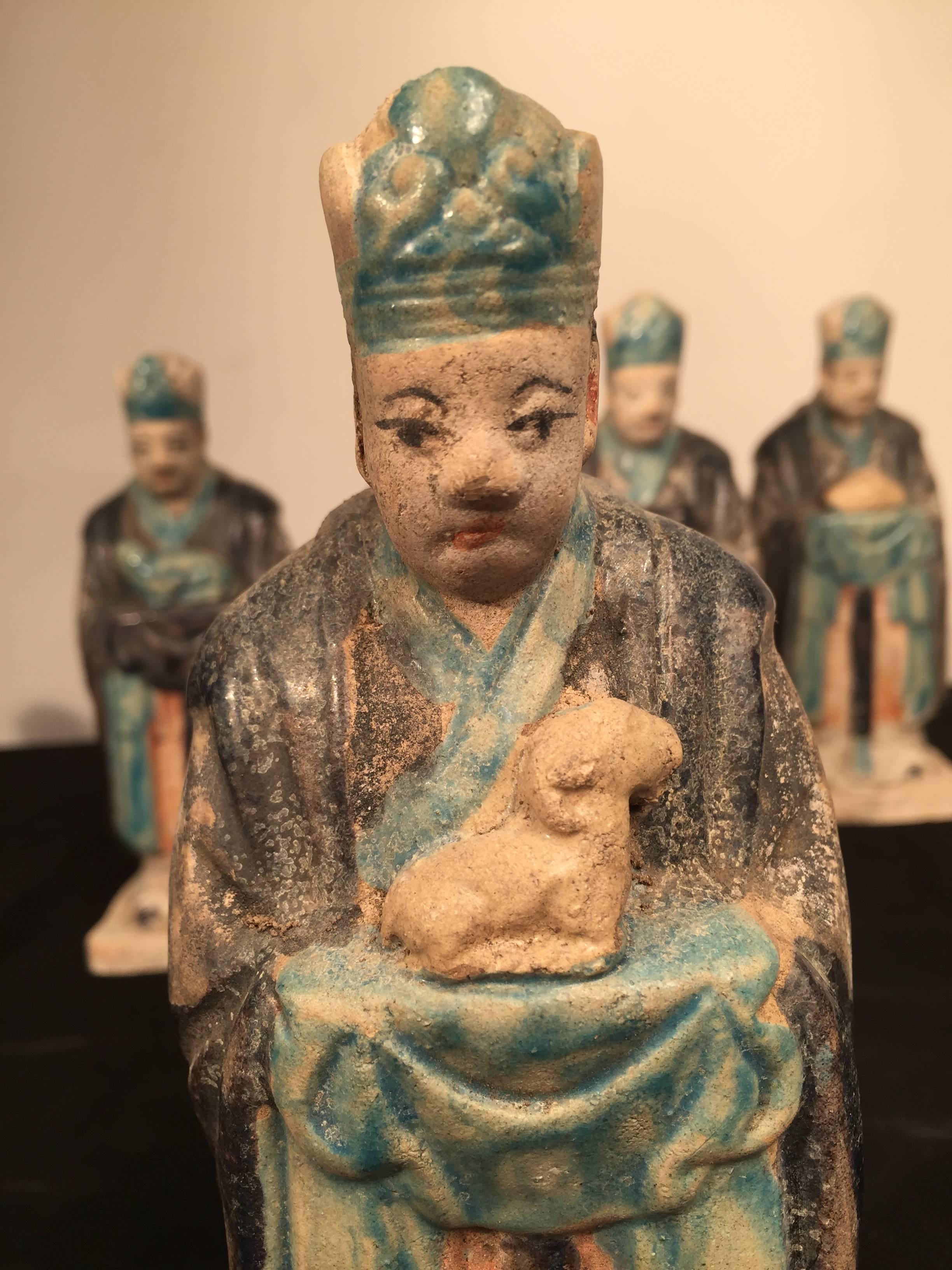 Important Ancient Chinese Zodiac Figure holding a SHEEP , Ming Dynasty 1368-1644

This interesting zodiac figure is one in a series of twelve (12) tomb figures each brandishing a different animal from the zodiac. Look for other listings offering the