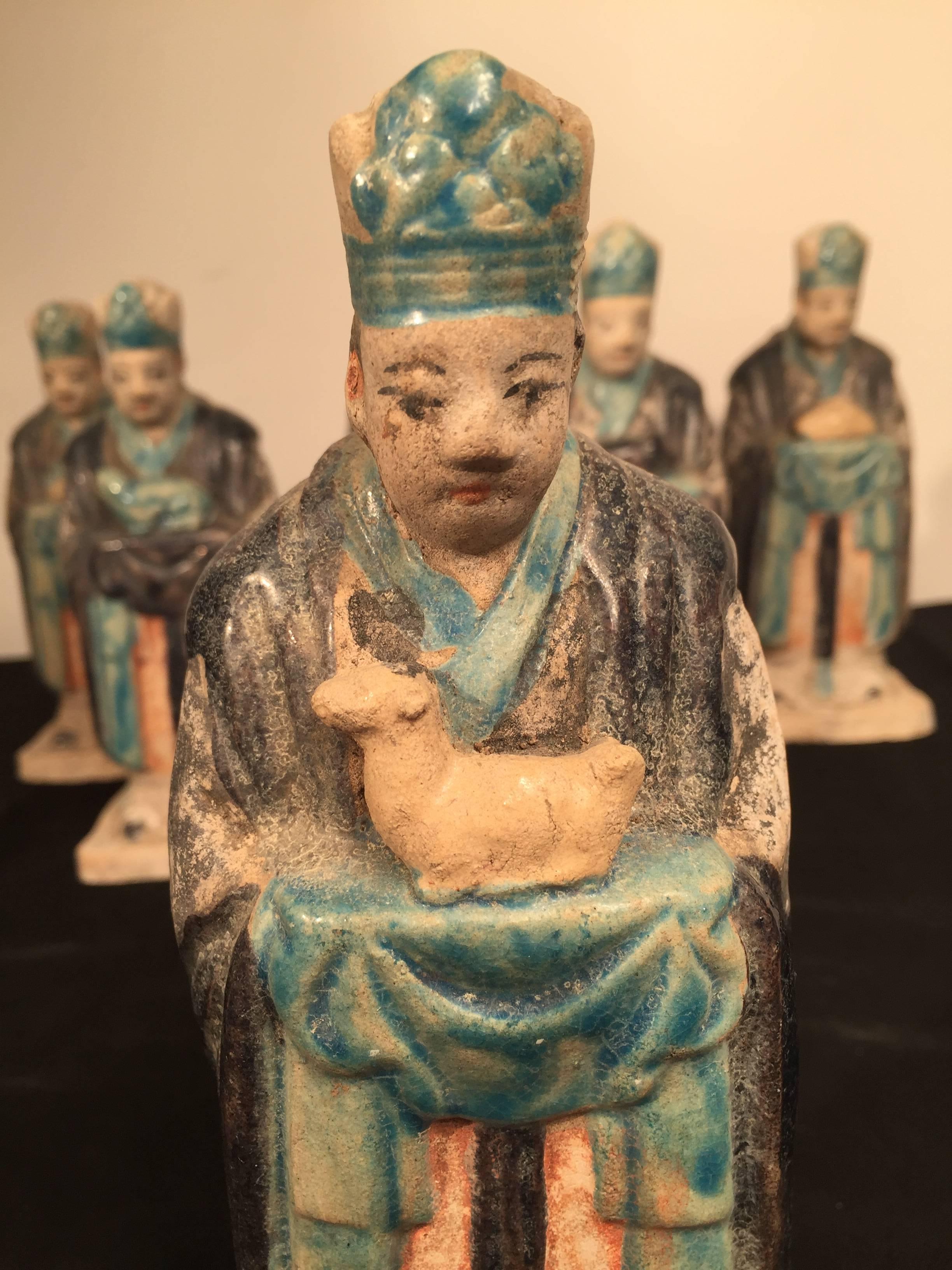 Important Ancient Chinese Zodiac figure holding a DOG, Ming Dynasty, 1368-1644

This interesting zodiac figure is one in a series of twelve (12) tomb figures each brandishing a different animal from the zodiac. Look for other listings offering the