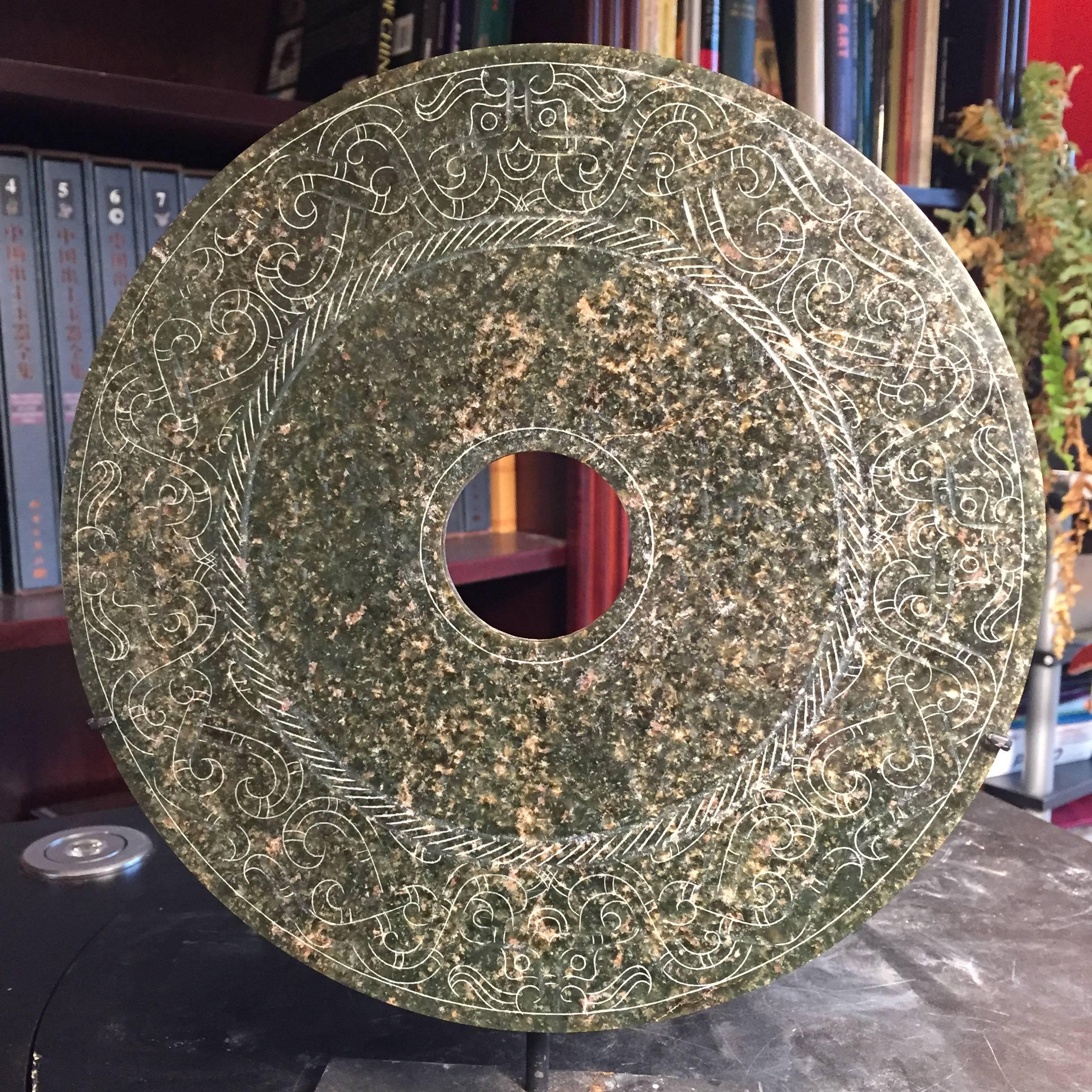 This is an authentic Chinese ancient jade bi disc from the Han dynasty (220 BC-220AD) This comes from our private ancient Chinese jade collection which was formed from, 1990-2005.

Dimensions: the bi disc is 9.5 inches diameter and .22 inches thick.