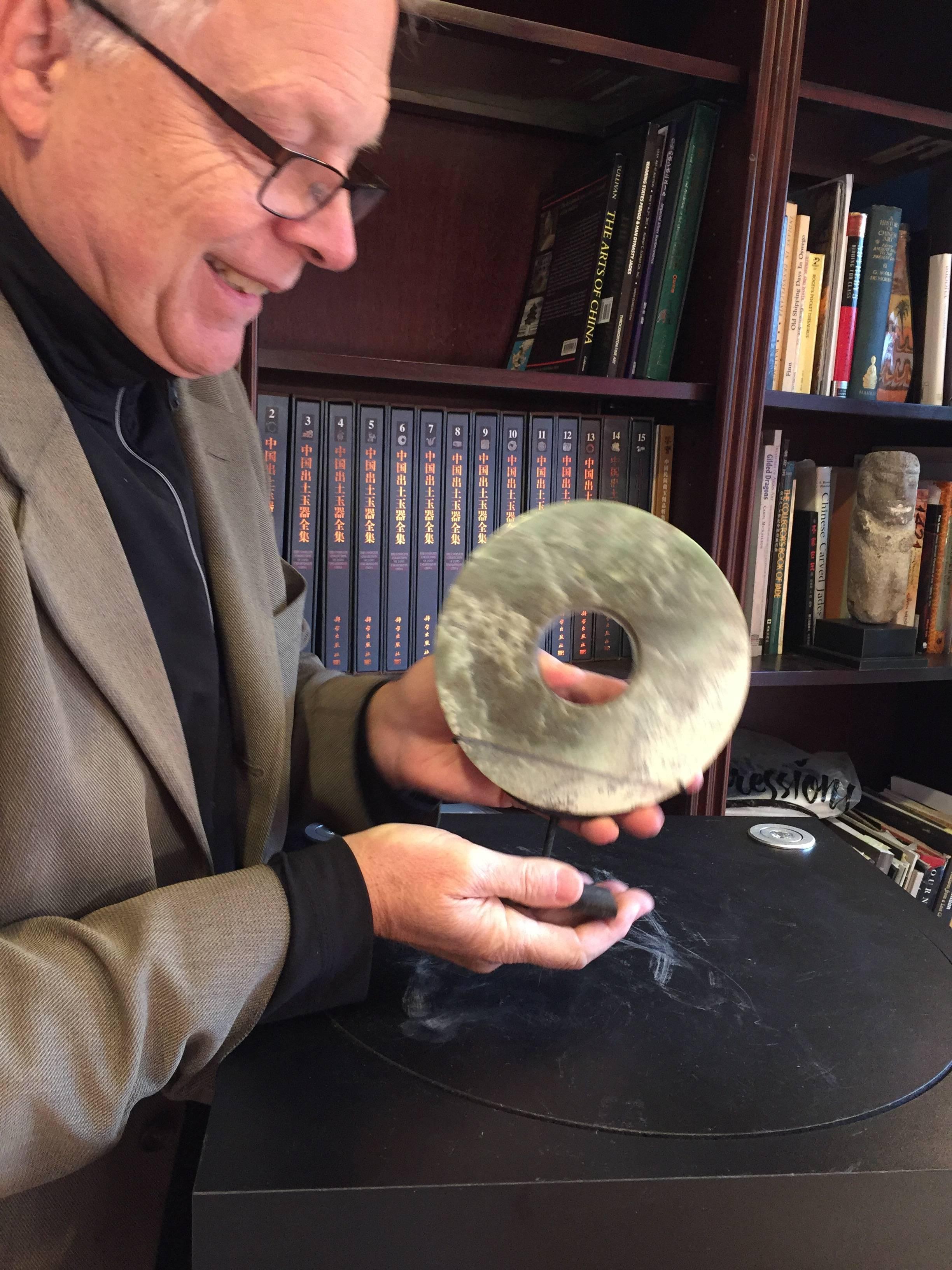 This is an authentic Chinese ancient jade bi disc from the Qi Jia Culture, Northwestern China, 3,000-2,000 BCE. This comes from our private collection. 

Dimensions: the bi disc is 6.8 inches diameter and with stand it is 9.5 inches