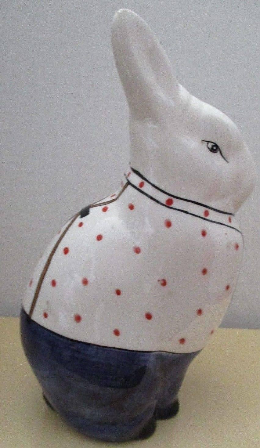 Here's a beautiful and unique way to accent your indoor or outdoor space with this very unusual treasure from Italy! 

This is a superb hand-painted and hand glazed Mid-Century Modern ceramic effigy of a rabbit with a beautiful red and blue coat