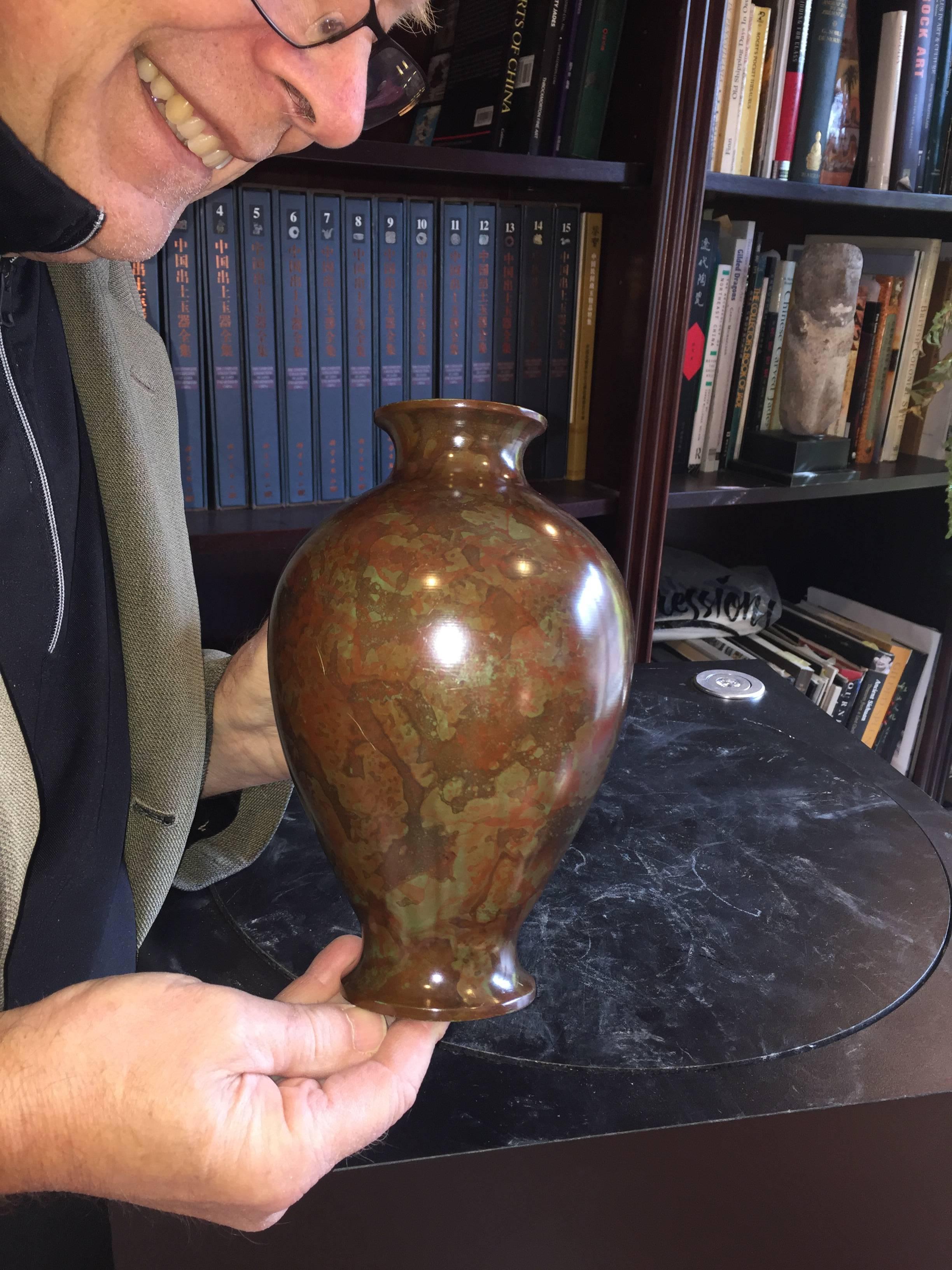 Japan, a one of a kind hand cast bronze vase masterfully hand finished in a sumptuous murashido red oil spot patina with green and dark brown highlights. Murashido is a dipping technique where the hot bronze is covered in oil immediately after