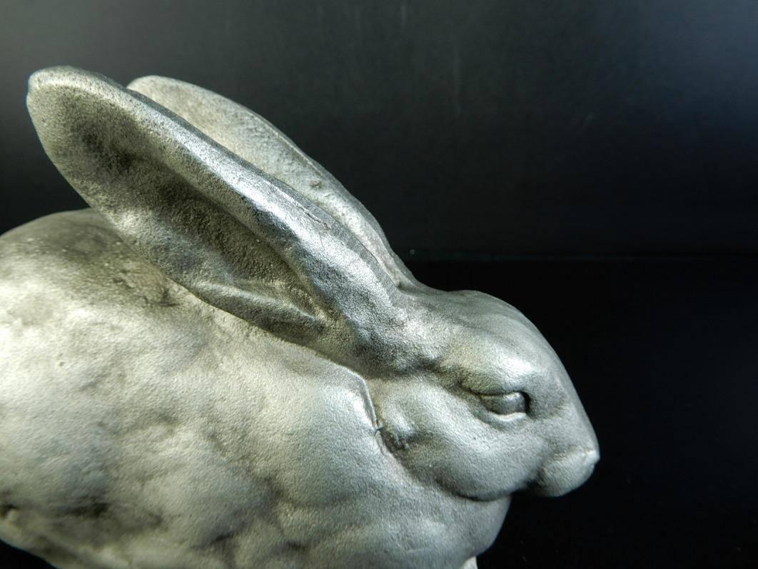 A charming white bronze or iron rabbit from Japan, hand caste and dating to Mid-Century Modern era, 1950-1960.

Well detailed and finely rendered. For the rabbit enthusiast.

Great garden candidate!

Dimensions: 7.5 inches long and 3.5 inches