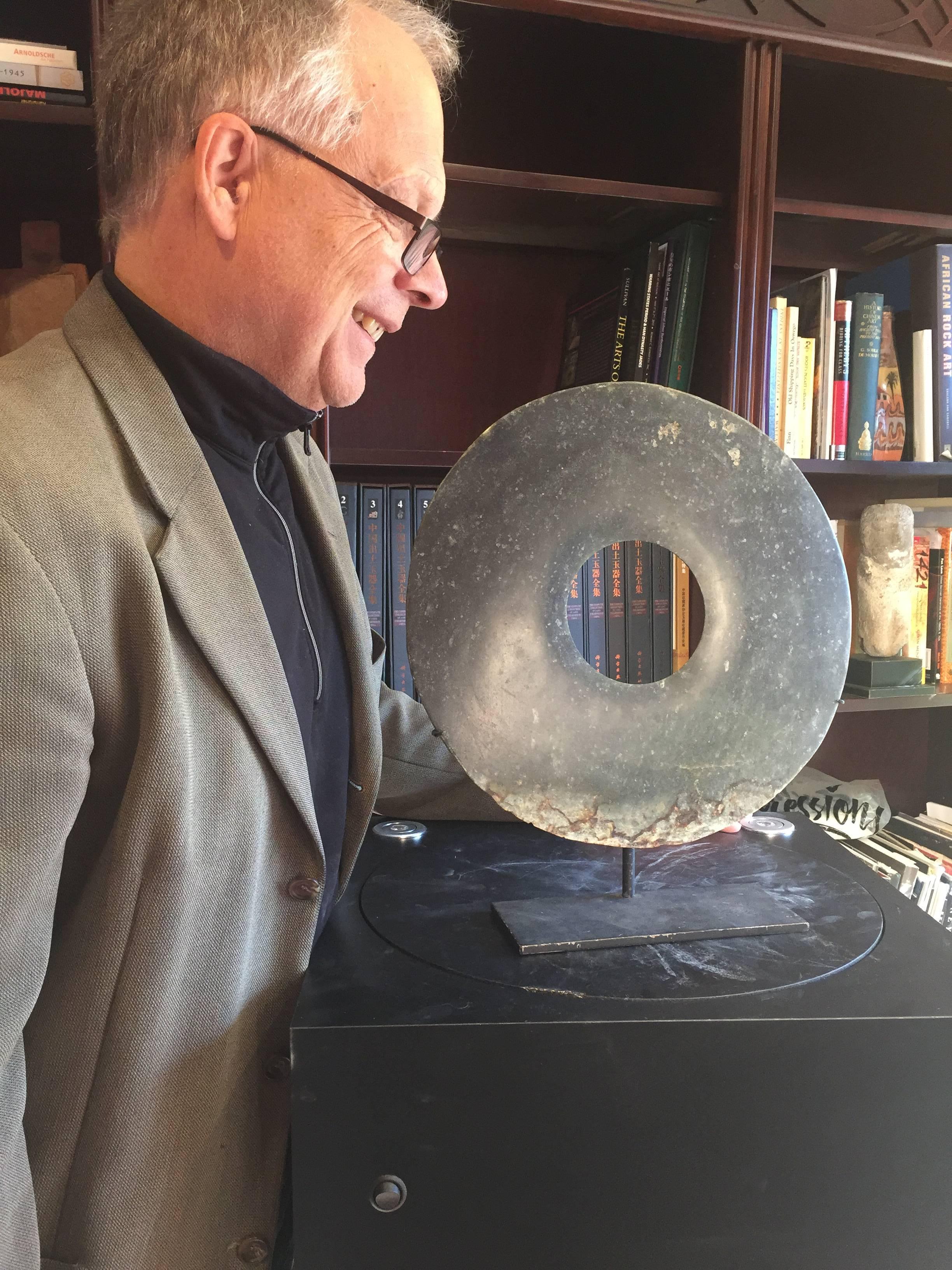 This is an authentic and extraordinary large Chinese ancient jade bi disc from the Qijia Culture, Northwestern China, 3000-2000 BCE. This comes from our private collection which we formed over a period of twenty five years while traveling