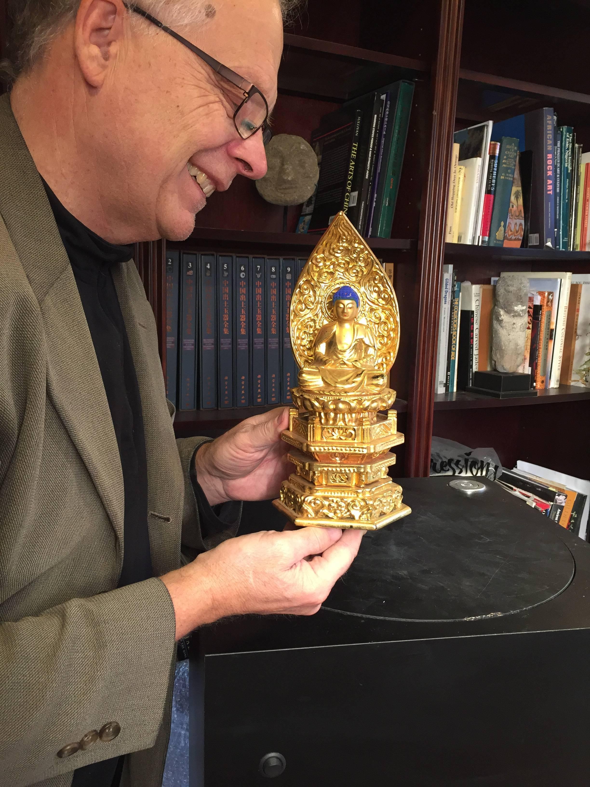This is a lovely Japanese gold gilt and lacquered wooden Buddha seated in meditation mudra. We acquired it from a large Japanese collection this past year from one of many buying trips.

Our Buddha was hand-carved and hand gilt and then the head
