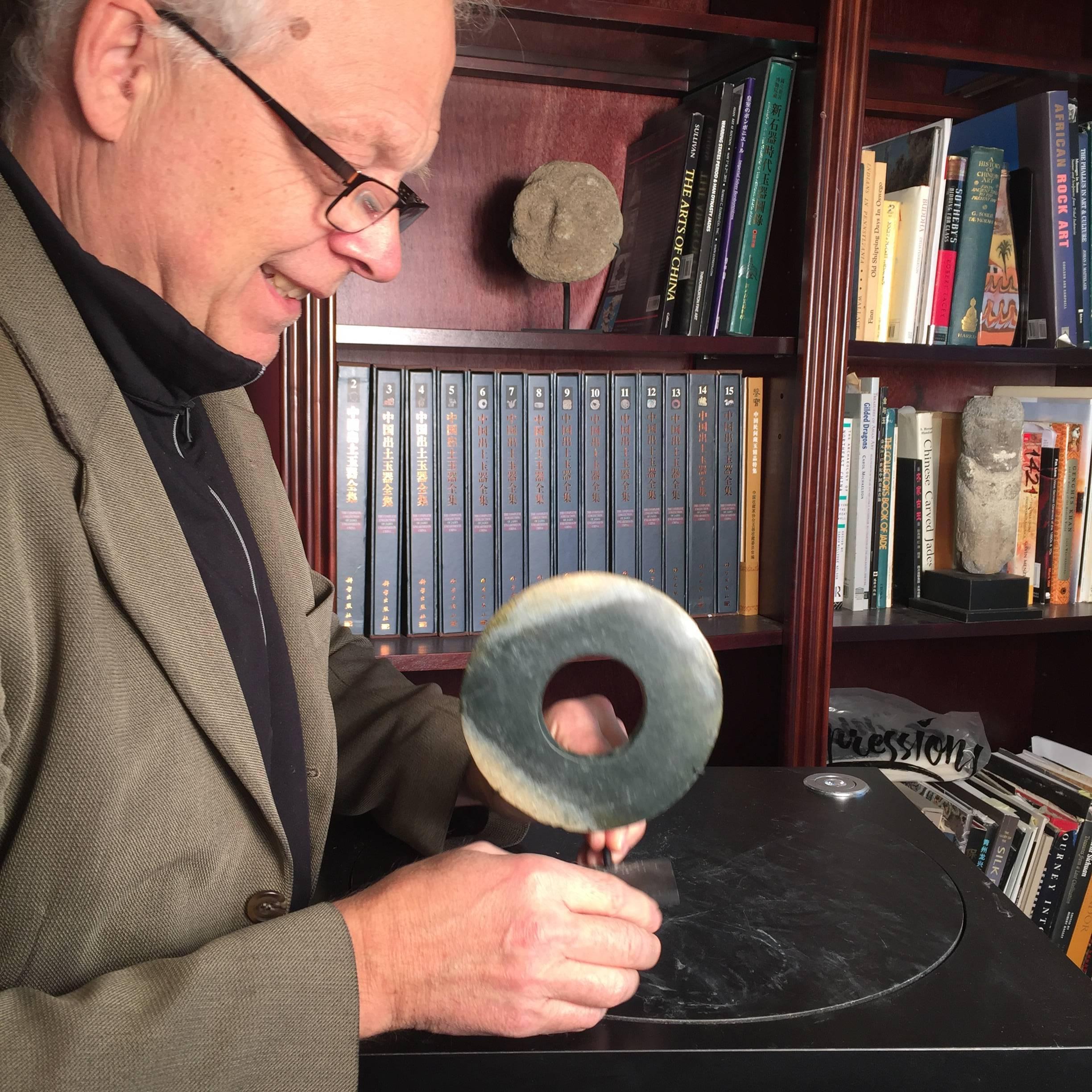 This is an authentic Chinese ancient jade bi disc from the Qi Jia Culture, Northwestern China, 3000-2000 BCE. This comes from our private collection. 

Dimensions: the bi disc is 5.75 inches diameter and 7.5 inches high with custom stand which is