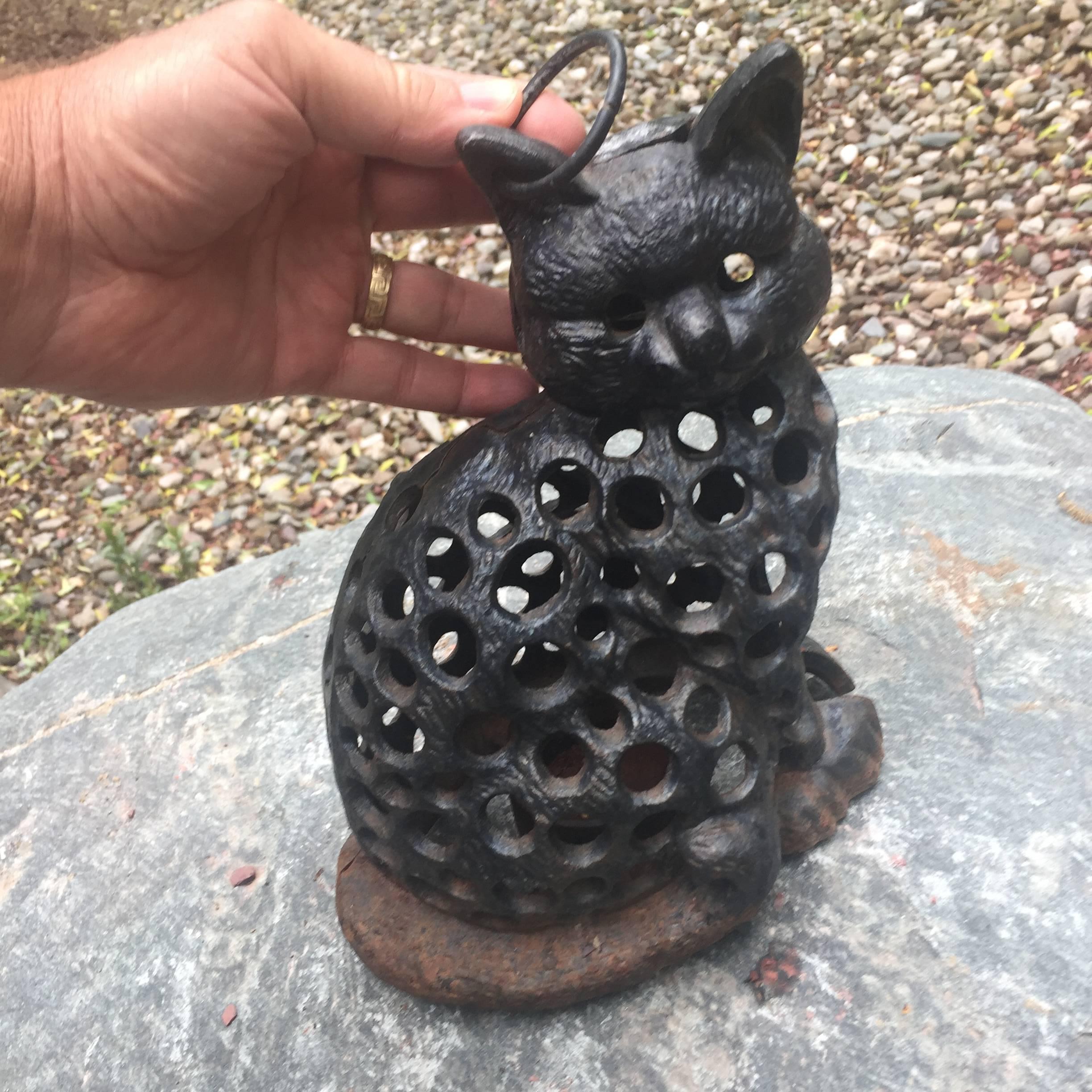 A charming Japanese cat antique lantern hand cast and crafted in black iron with removable base for inserting a candle or it might be electrified

Dimensions: 9.5 inches high and 7 inches wide

Only one.

Schneible Fine Arts has been dealing