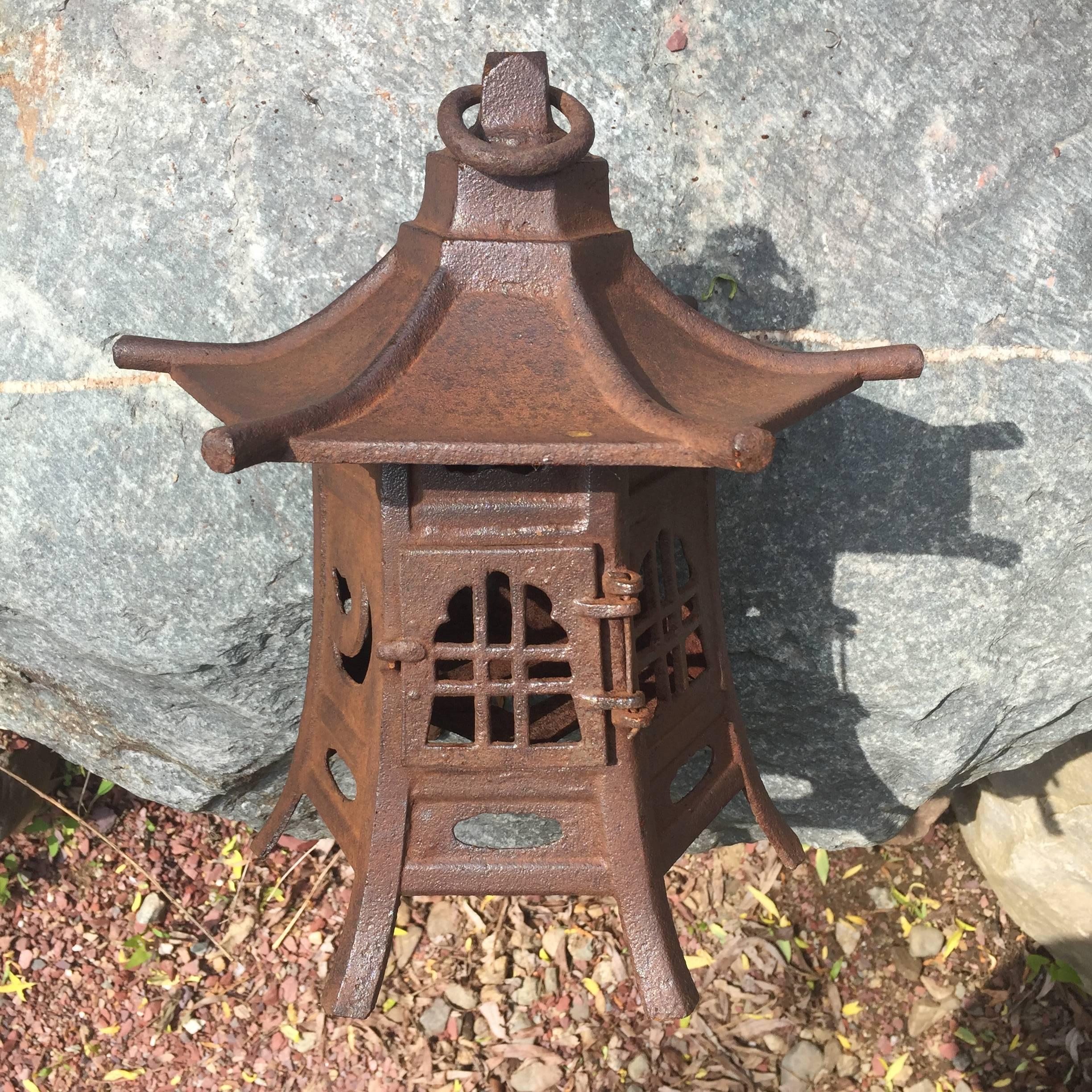 Japan, an unusual and handsome large handcrafted iron lantern with unusually simple lines and fine details.

This is the first of this style we have seen in over fifteen years of dealing with fine Japanese garden ornaments.

Dimensions: 12 inches