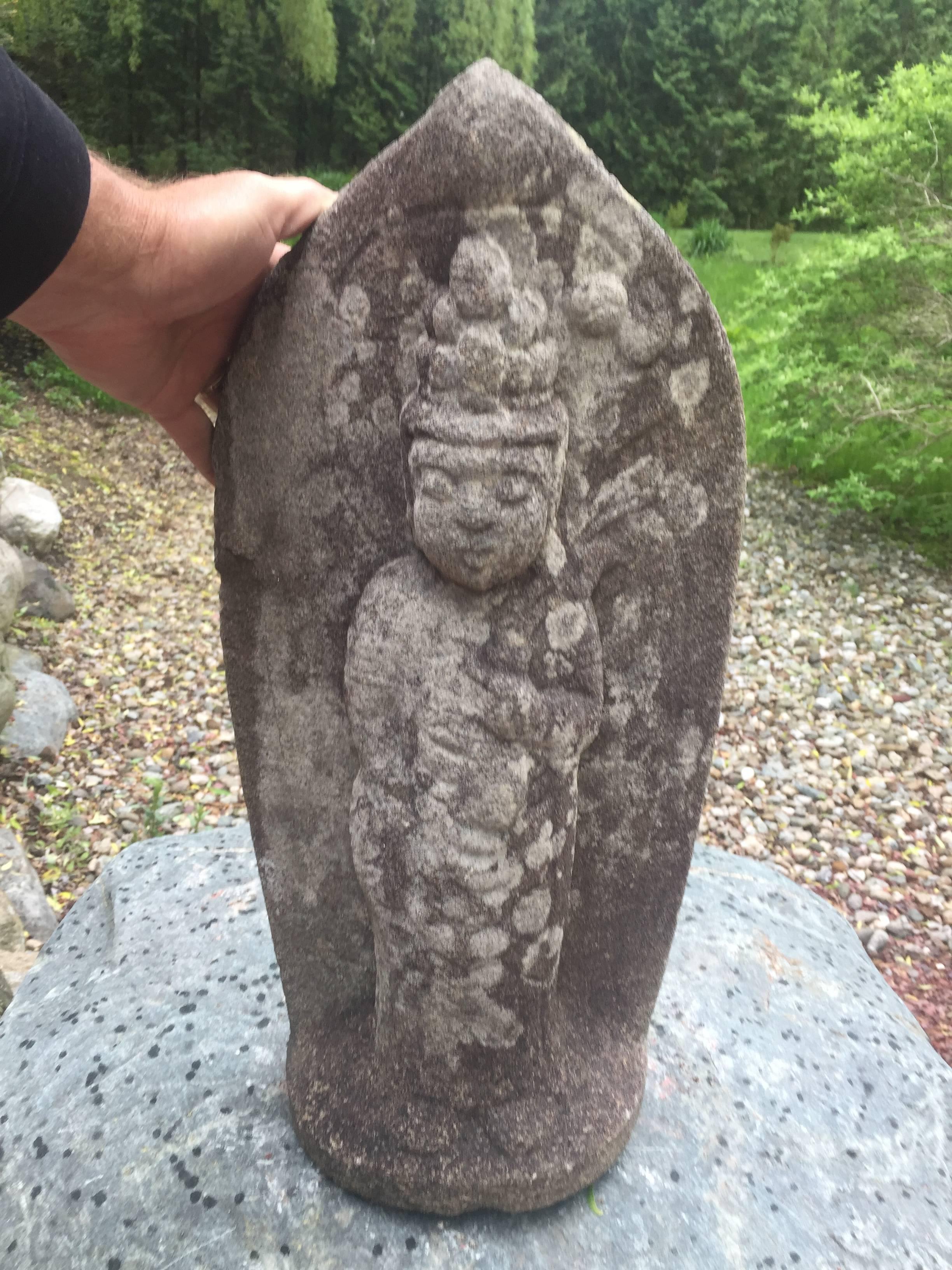 An early large and hard to find Japanese stone Kannon Guan Yin in the gassho mudra of adoration. It has been beautifully hand-sculpted from a grey-hued sedimentary stone with original lichen from great age and residing in a Kyoto garden for decades.