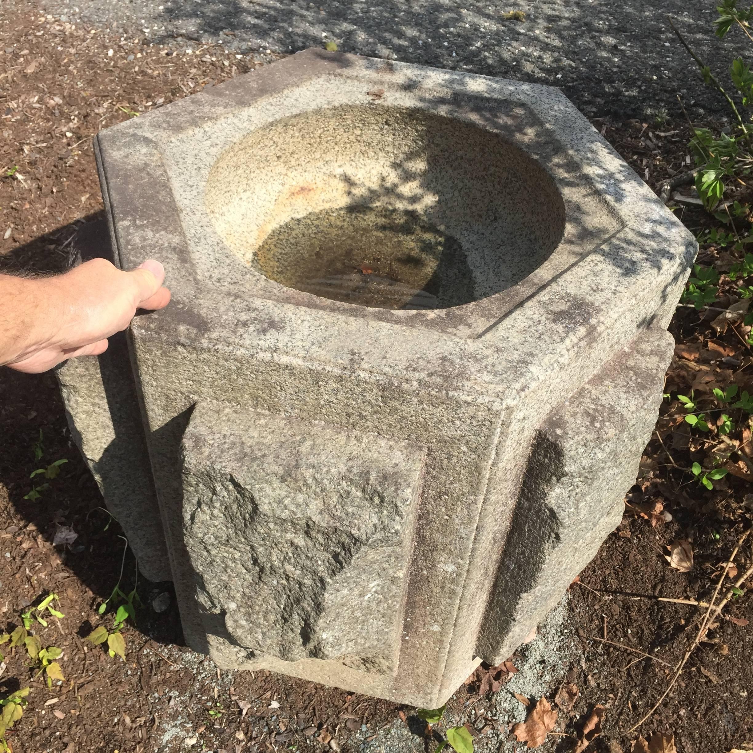 Japan, a stunning, unique large hand-carved antique solid granite stone planter or water basin -tsukubai- hand-cut from a large mountain boulder replete with natural rough  -mountain skin-  vertical external elements as shown. 

One of a kind and