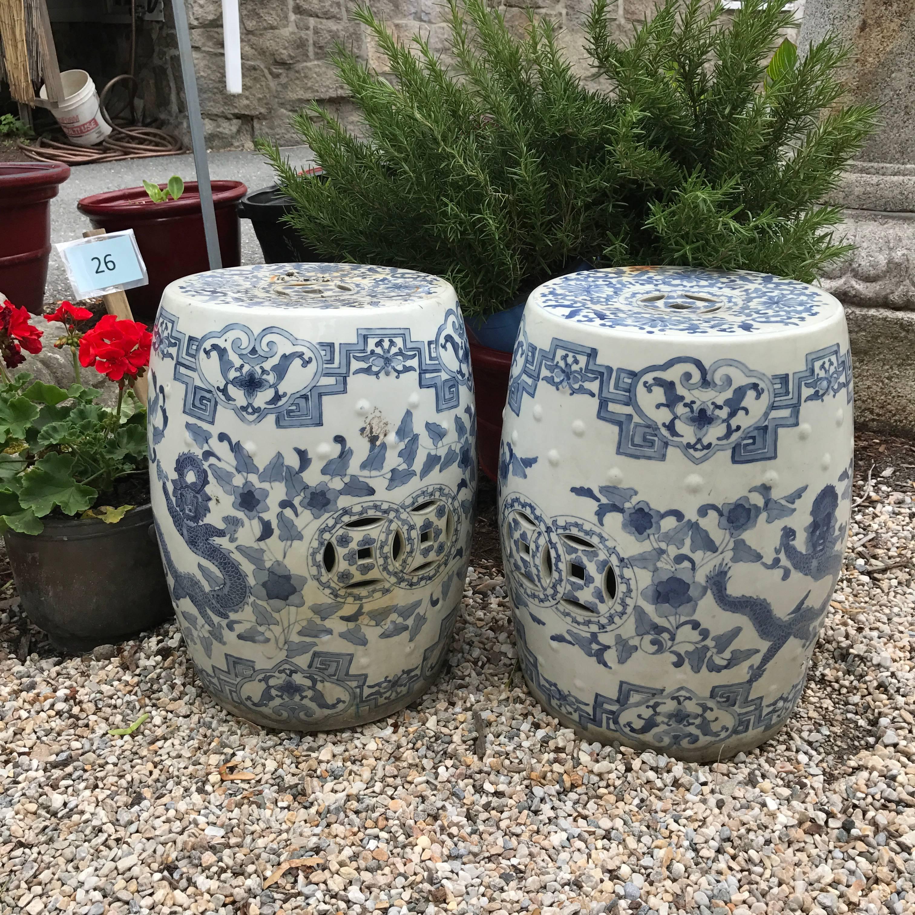 Chinese antique hand-painted blue and white garden stools (garden seats), ornately hand painted pair in a prolific floral and mountain scape design.

These attractive heavy, thick ceramic stools make excellent portable seats or serve as attractive