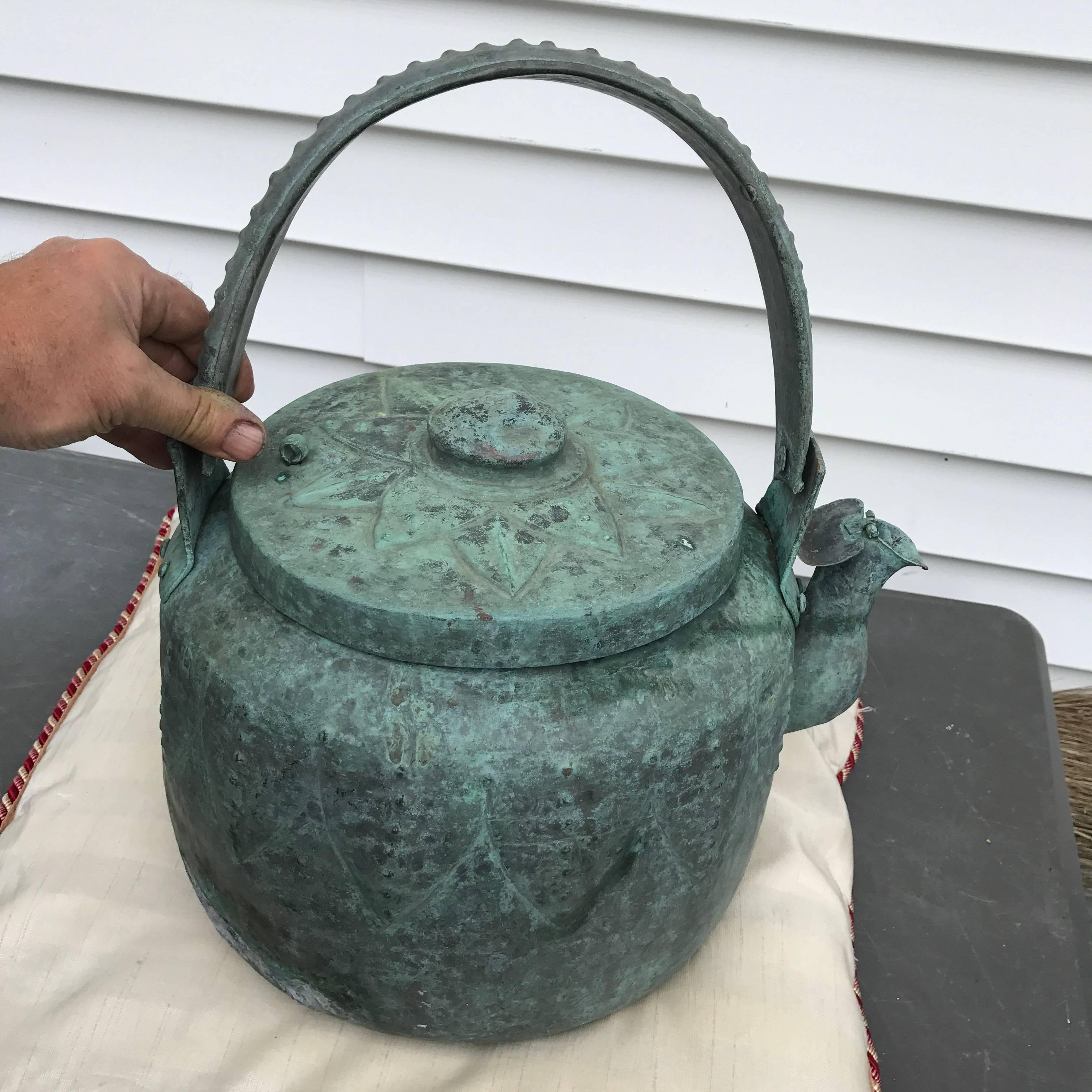 A superb large Japanese large hand-wrought bronze Lotus Leaf pattern Vessel for tea or water yakan possessing a lovely blue green patina. 

Dimensions: Big, 16 inches tall to top of handle and 13 inches wide

Provenance: Old Shigaraki