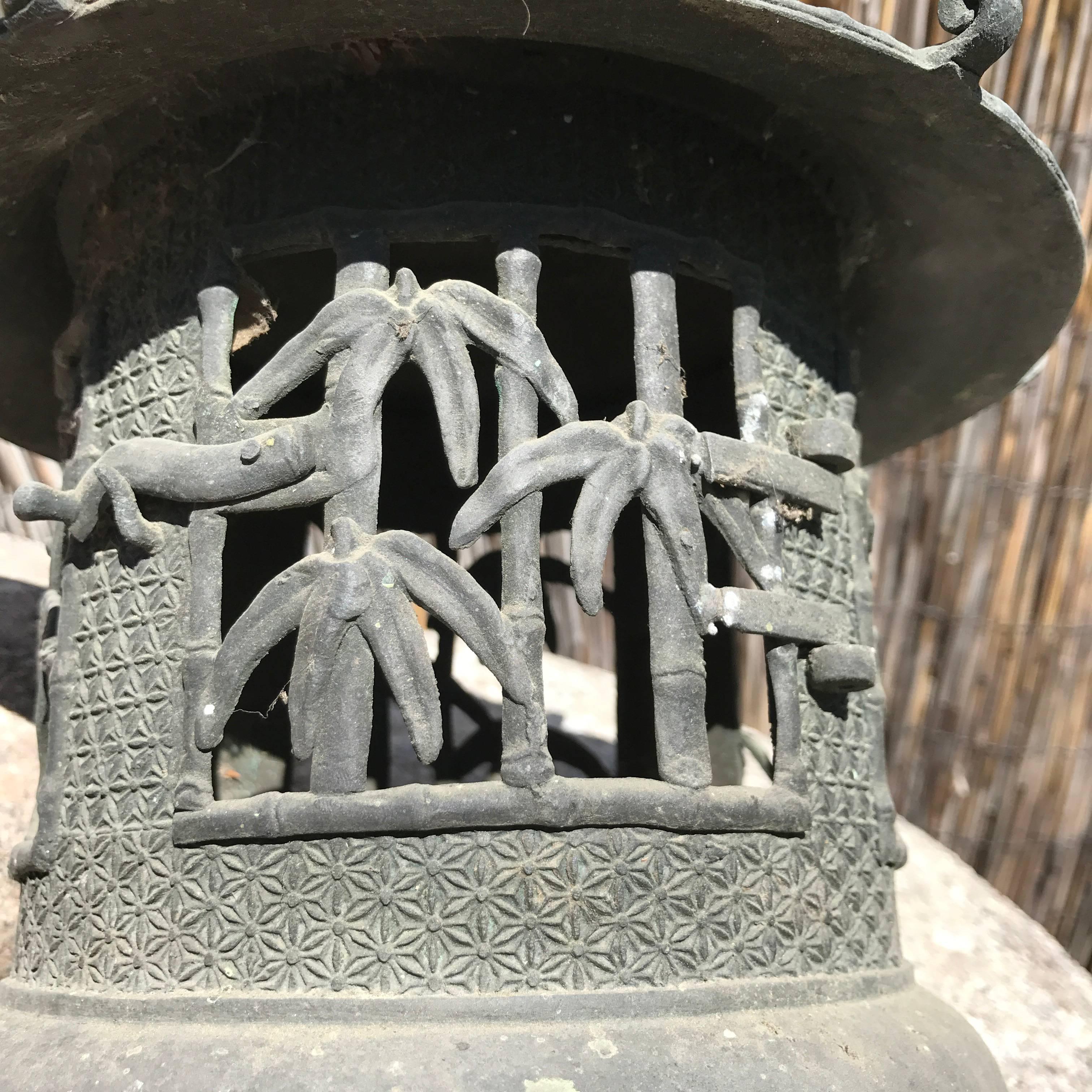 Japan Lantern- enjoy indoors or outdoors
Hand cast in solid bronze with door opening to insert your own candle or oil lamp.

Pine tree and floral designs. 

Beautiful Pagoda form with tightly cast woven pattern roof 

Dimensions: 15 inches tall and