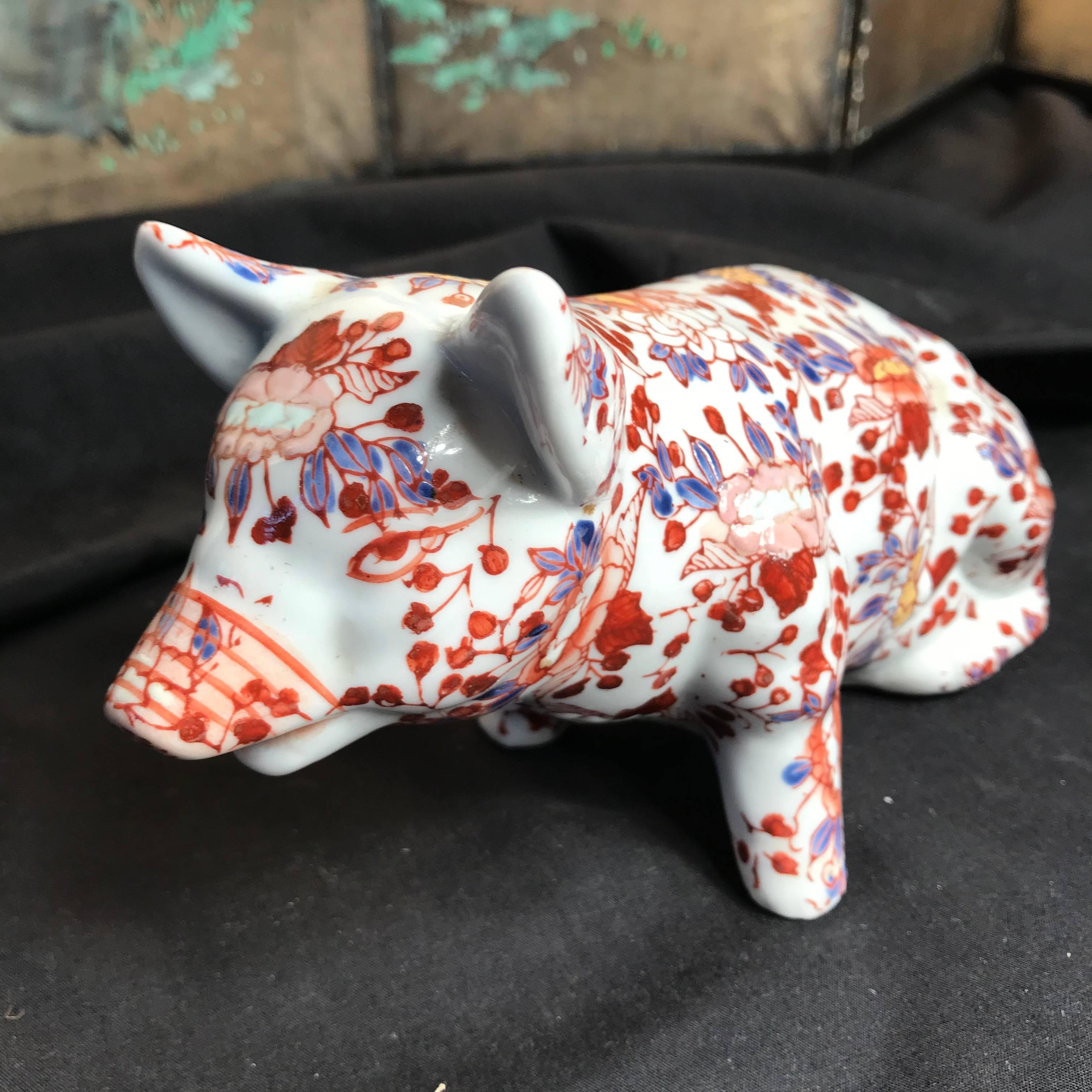 Japanese red enameled porcelain boar or pig, sculpture Okimono 

Maker: Imari red enamels over blue, yellow, and green under glazing

Dimensions: 4.5 inches tall and 7 inches length

A good sized sculpture.
Hand enameled.
Handcrafted.
Only one.