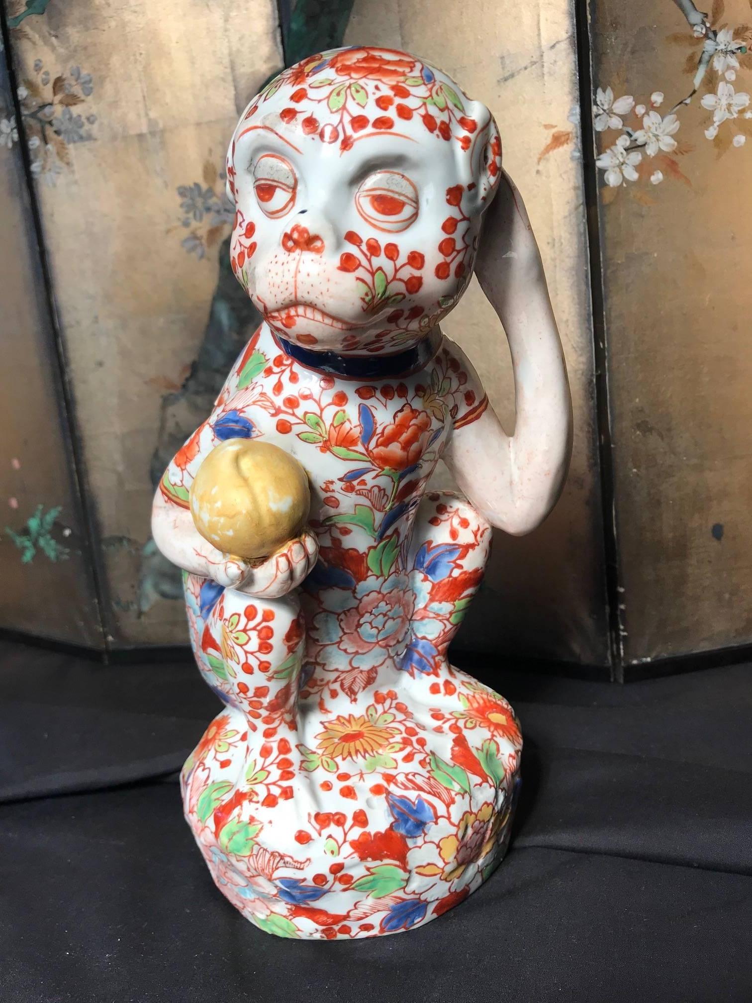 Japanese red enameled porcelain monkey holding the peach of immortality, sculpture Okimono signed base.

Maker: Imari red enamels over blue, yellow, and green under glazing

Dimensions: Big 11 inches tall and 7 inches wide and 5 inches deep

A large