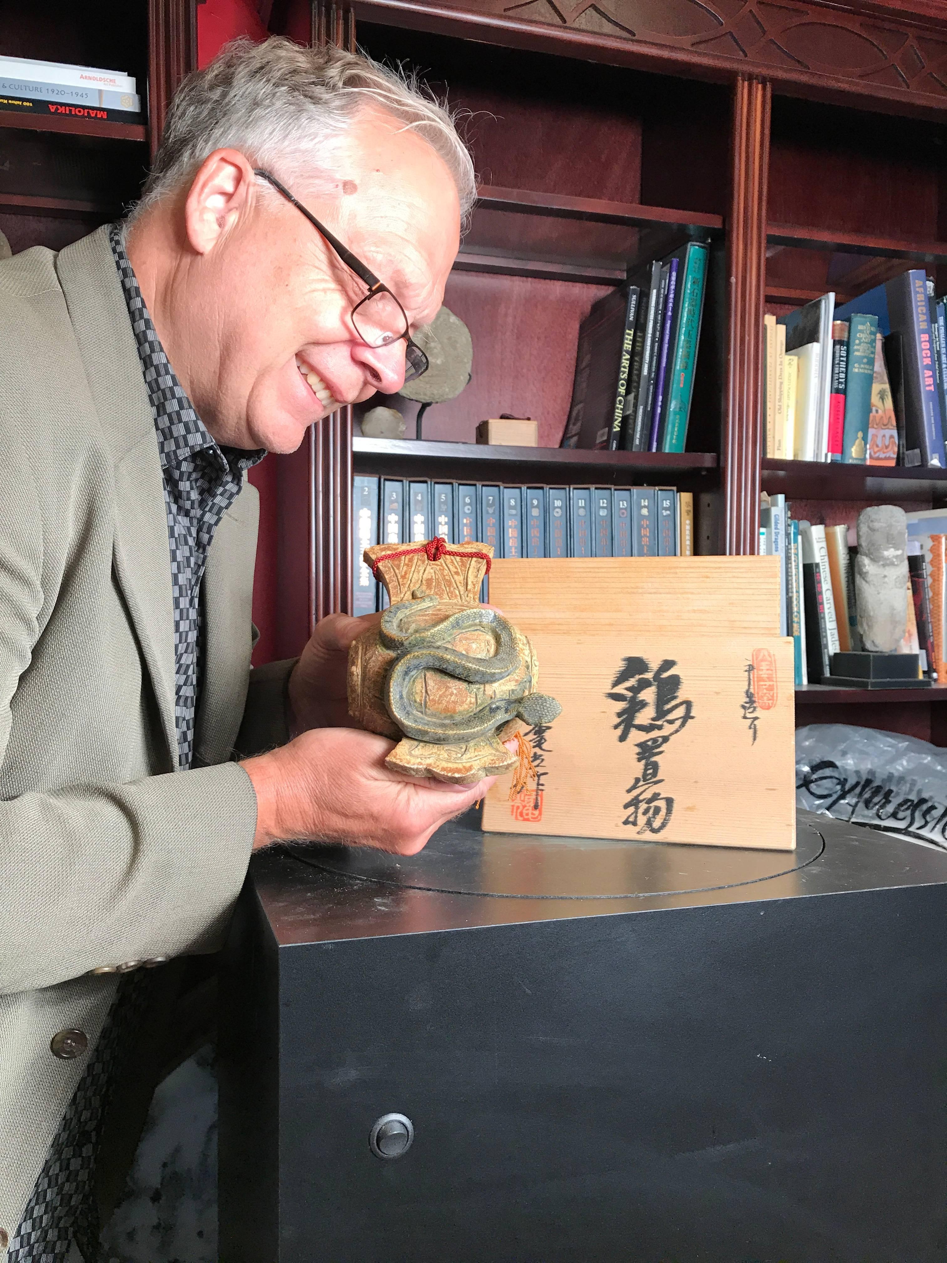 Mint, Signed and boxed

Japan, a fine handmade and hand-painted Snake Zodiac on drum ceramic sculpture- an unusual motif on Japanese ceramics.

The ceramic animal has finely detailed ears, eyes, mouth, coiled back, legs, and hand-painted in