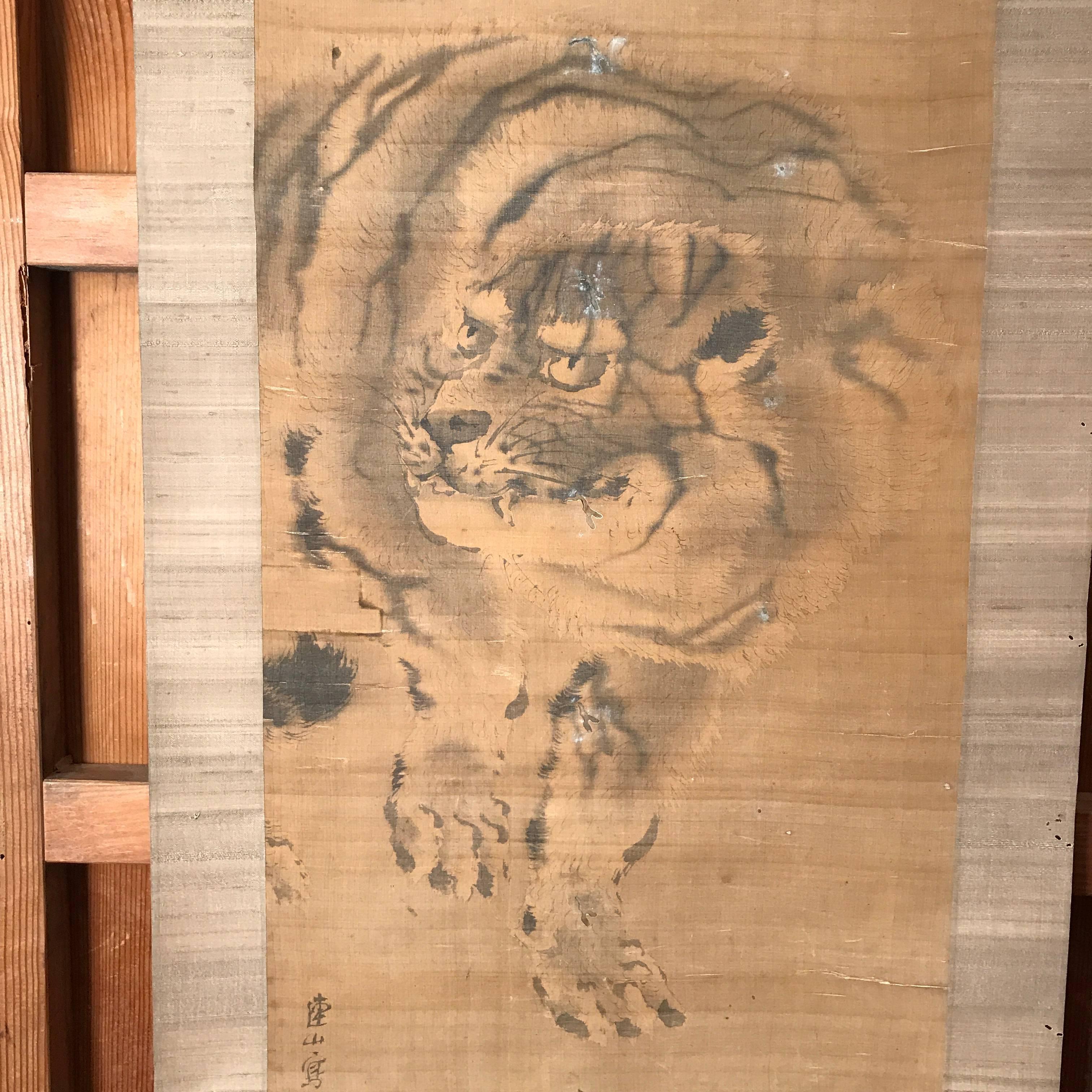 Stealthy tiger 

Antique hand-painted scroll on paper, signed.
Dimensions: 23.75 inches wide and 68 inches length
Hand written Collector signature as photographed
Bone rollers.

Japan, attractive quite old composition of a -Tiger on the Stealth-