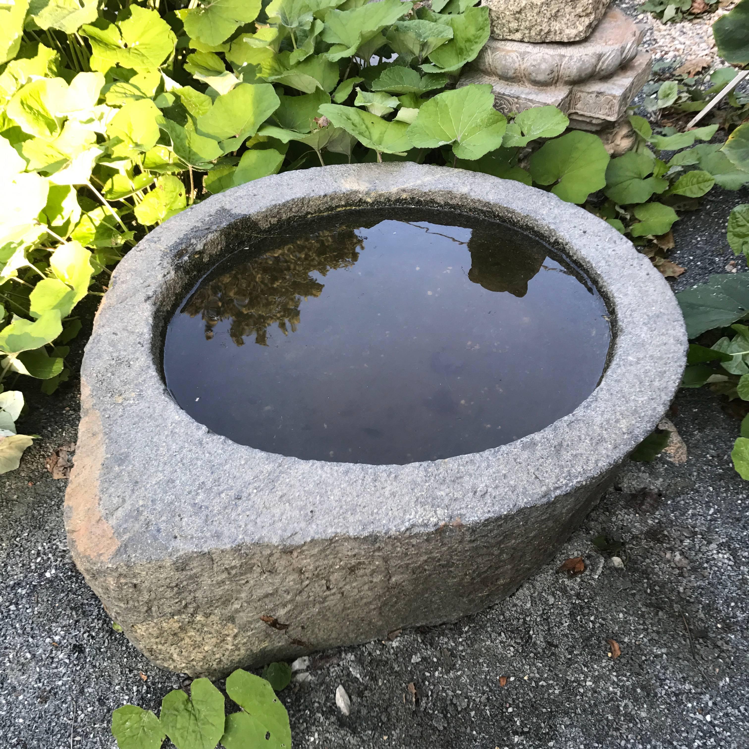 China, a visually attractive antique stone Tear Drop planter water basin hand-carved from solid limestone. At least 100 years old. 

Unique tear drop design. 

Dimensions: 10 inches tall and 32 inches diameter

Period: hand-carved in solid limestone