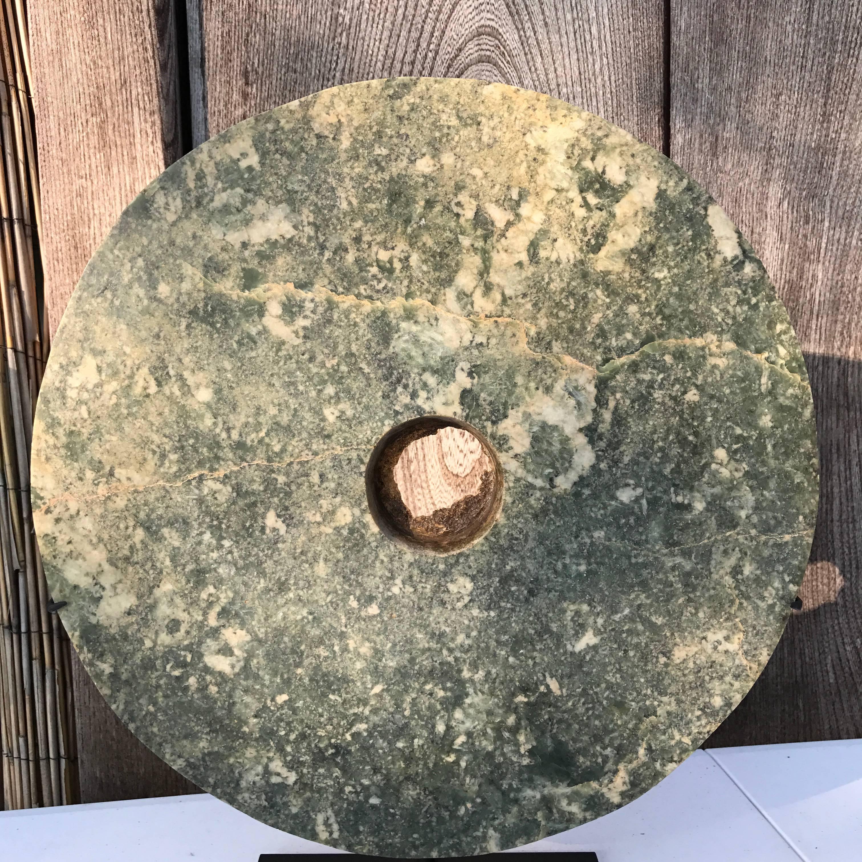 Ancient China, a large jade Bi disk measure: 14.75” diameter and .75” thick, Qijia culture (2200-1700 BCE)

Including Our Certificate of Authenticity

The thick round heavenly ritual jade of a medium mottled green jade stone partially altered and