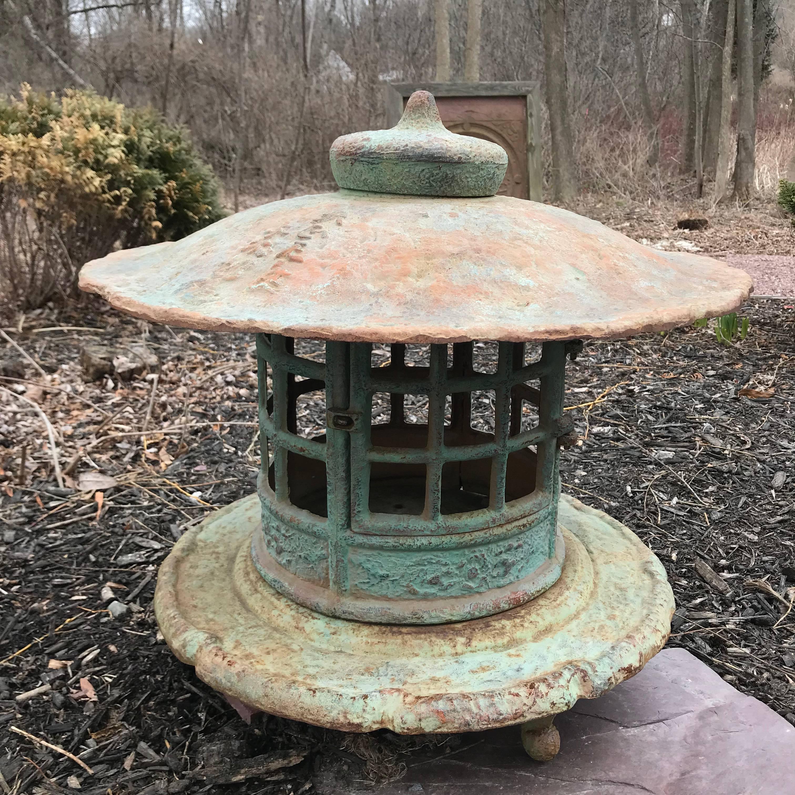 Japan, a fine large vintage hand cast iron Yukimi round top lantern with exquisite details from the early Showa period, 1930s-1940s

The striking and well proportioned old lantern is fashioned in three parts from solid iron as roof kasa and light