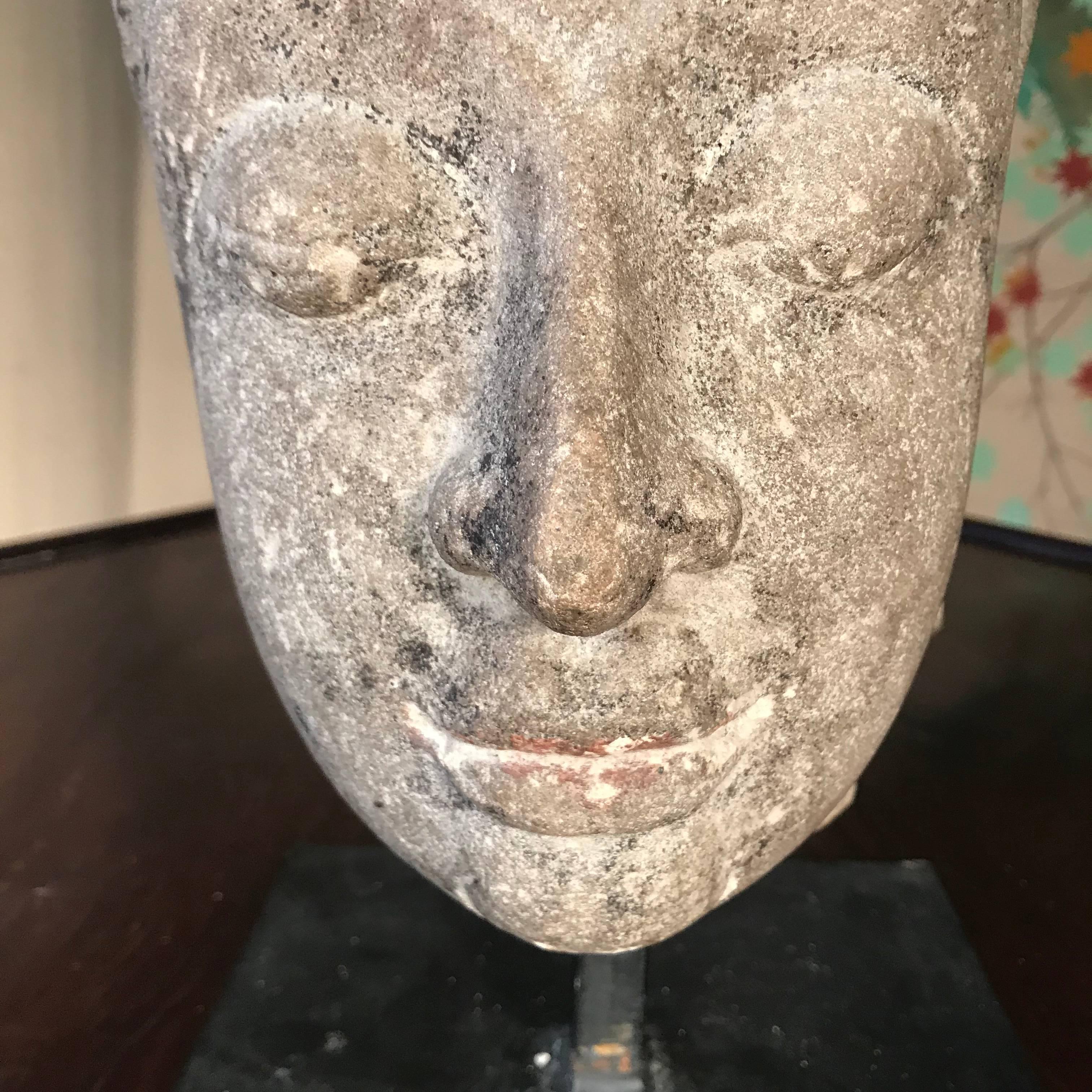 antique stone buddha head