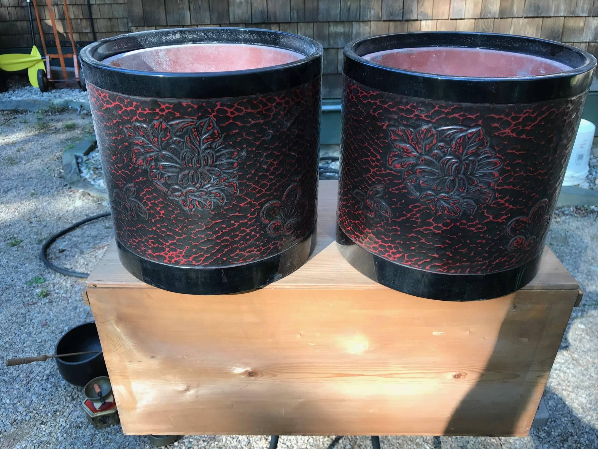 Glistening pair of (two) beautiful antique red lacquer carved chrysanthemum planters from old Japan dating to the early 1900s. The Original old kiri wood collector and storage box included .

A rare find. Fine quality.

Dimensions: Each is 12