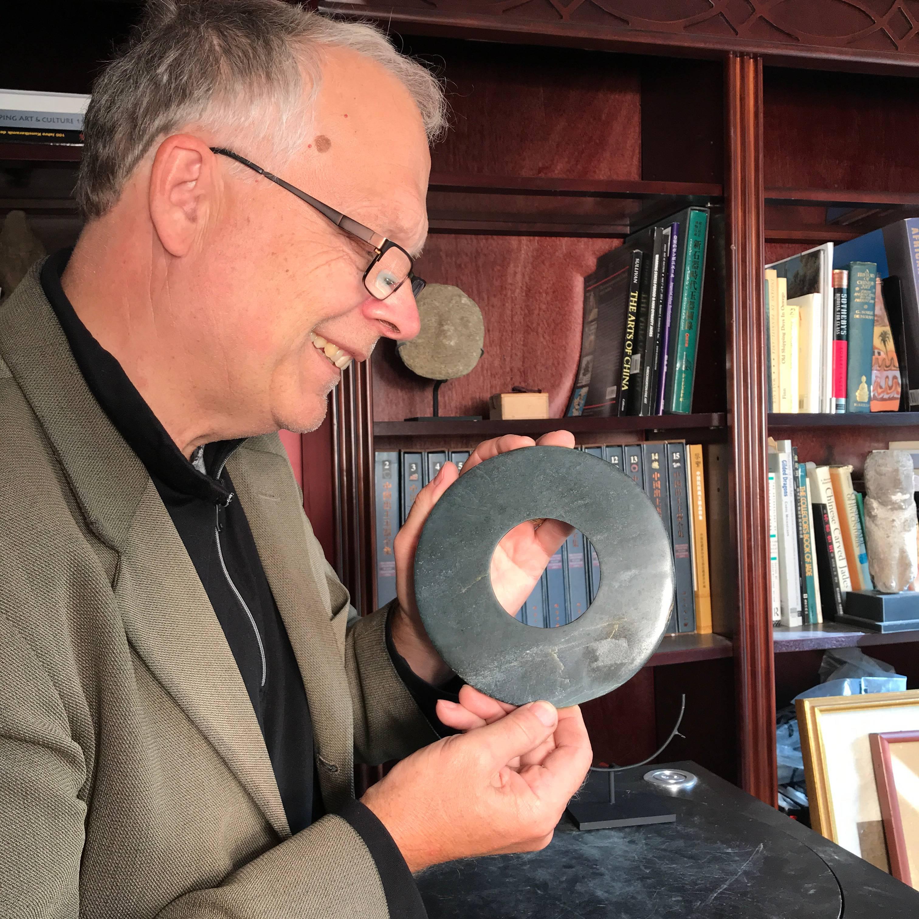 This is an authentic Chinese ancient jade bi disc from the Qi Jia Culture, Northwestern China, 3,000-2,000 BCE. This comes from our private collection. 

Dimensions: the bi disc is 6.25 inches diameter and with stand it is 8 inches high

Neolithic