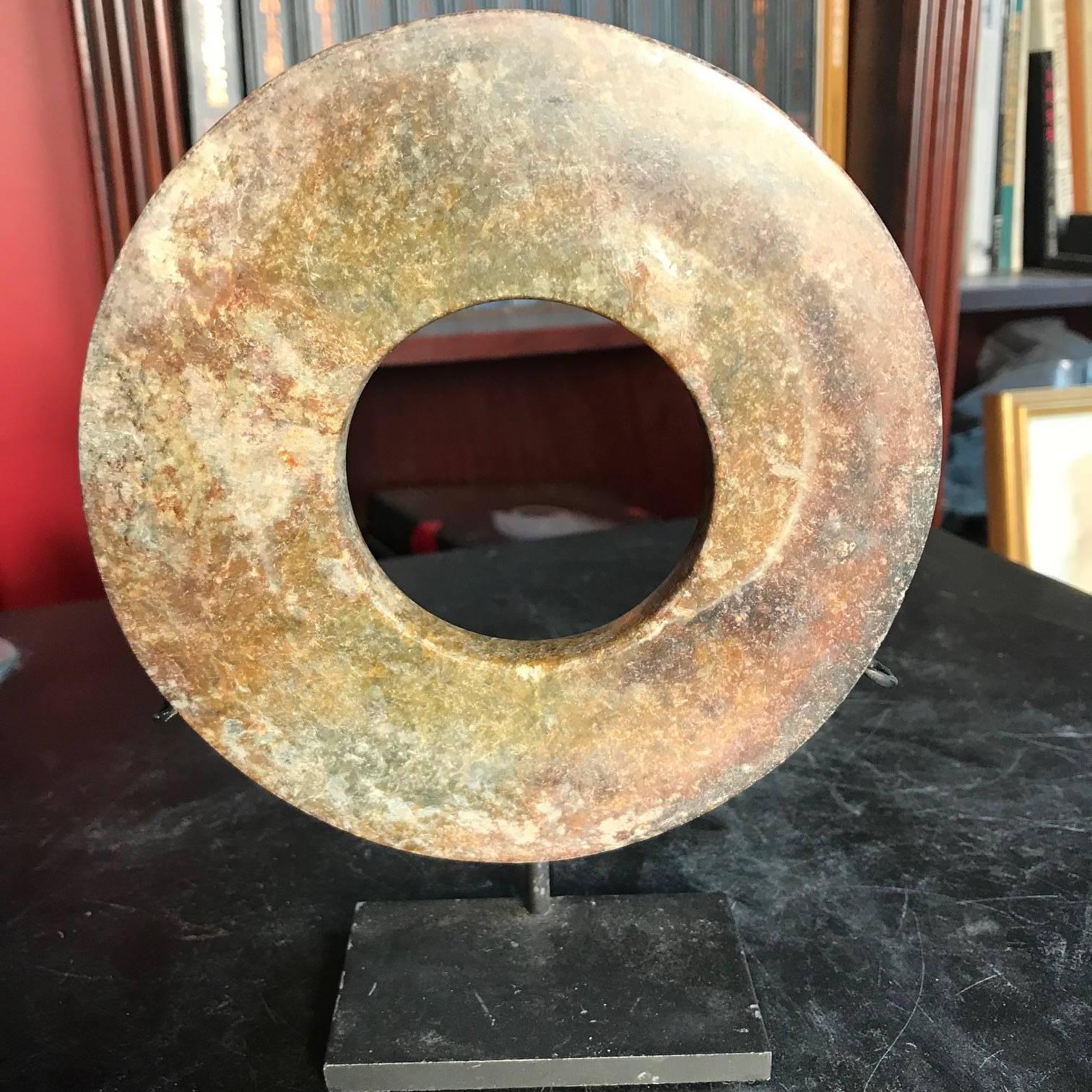 This is an authentic Chinese ancient jade bi disc from the Qi Jia Culture, Northwestern China, 3,000-2,000 BCE. This comes from our private collection. 

Including Our Certificate of Authenticity

Dimensions: the bi disc is 5.67 inches diameter and