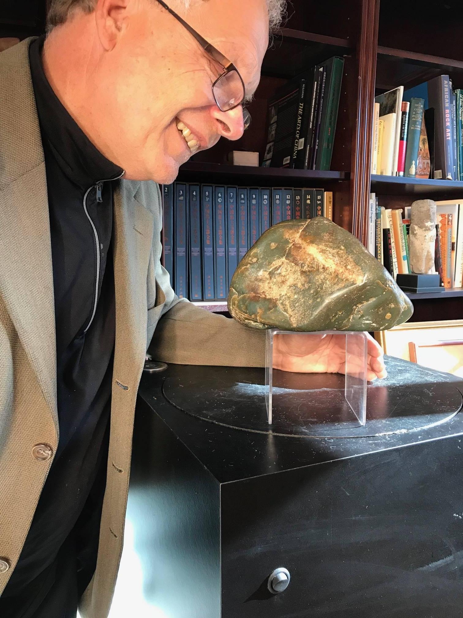 A fine large natural Hetien jade scholar rock in boulder form collected from the Khotan region of western China in 1995.

Weighs in at 14.1 pounds.

Beautiful color and quality.

A complimentary black hardwood display base is included.

Dimensions: