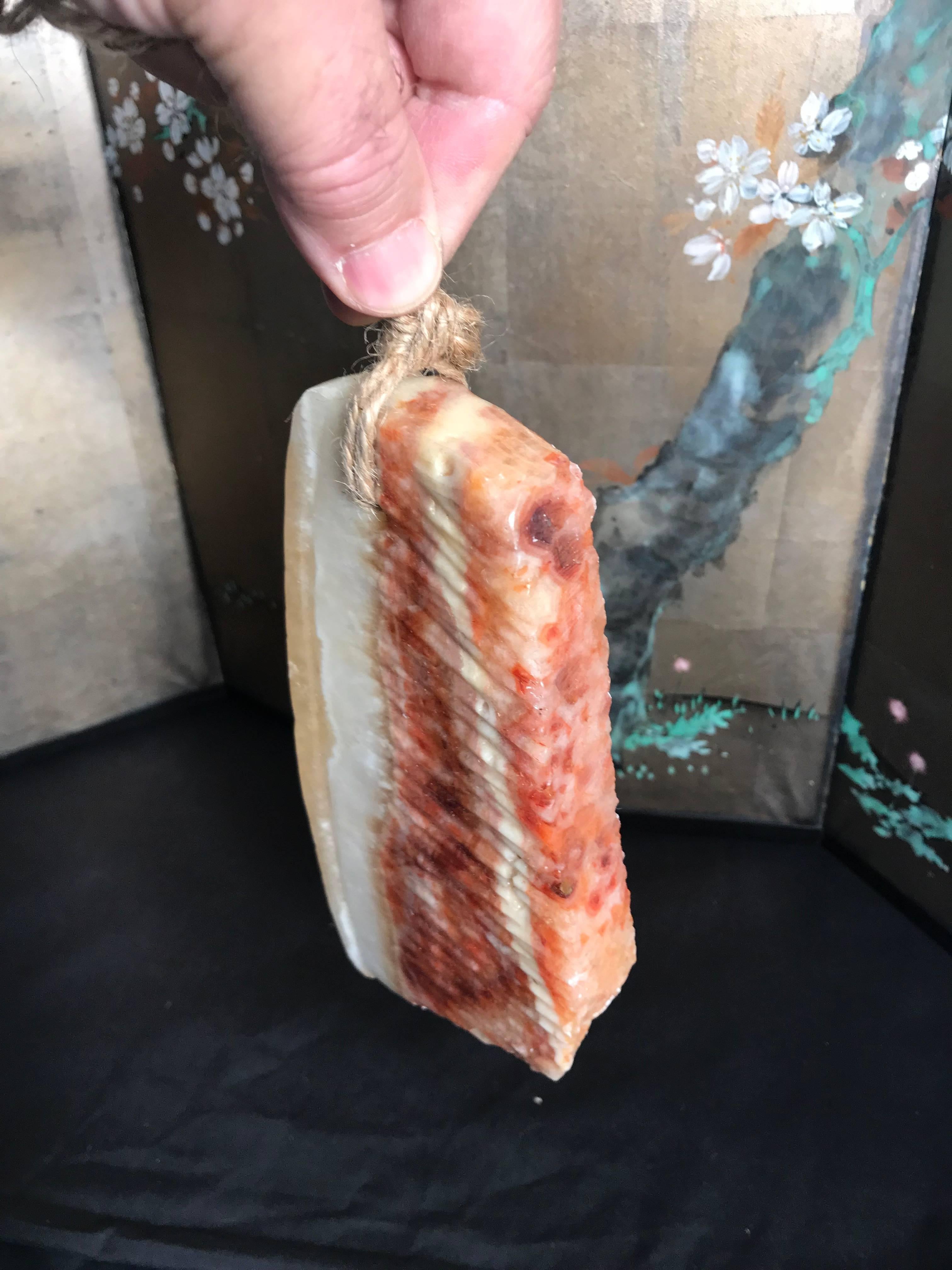 Here is an authentic example of a Chinese food stone (Shiwu) which imitates a real slice of meat.

Each piece is actually a found stone that resembles a thick cut of beef or pork. 

A fantastic natural stone, meat or food these stones are widely