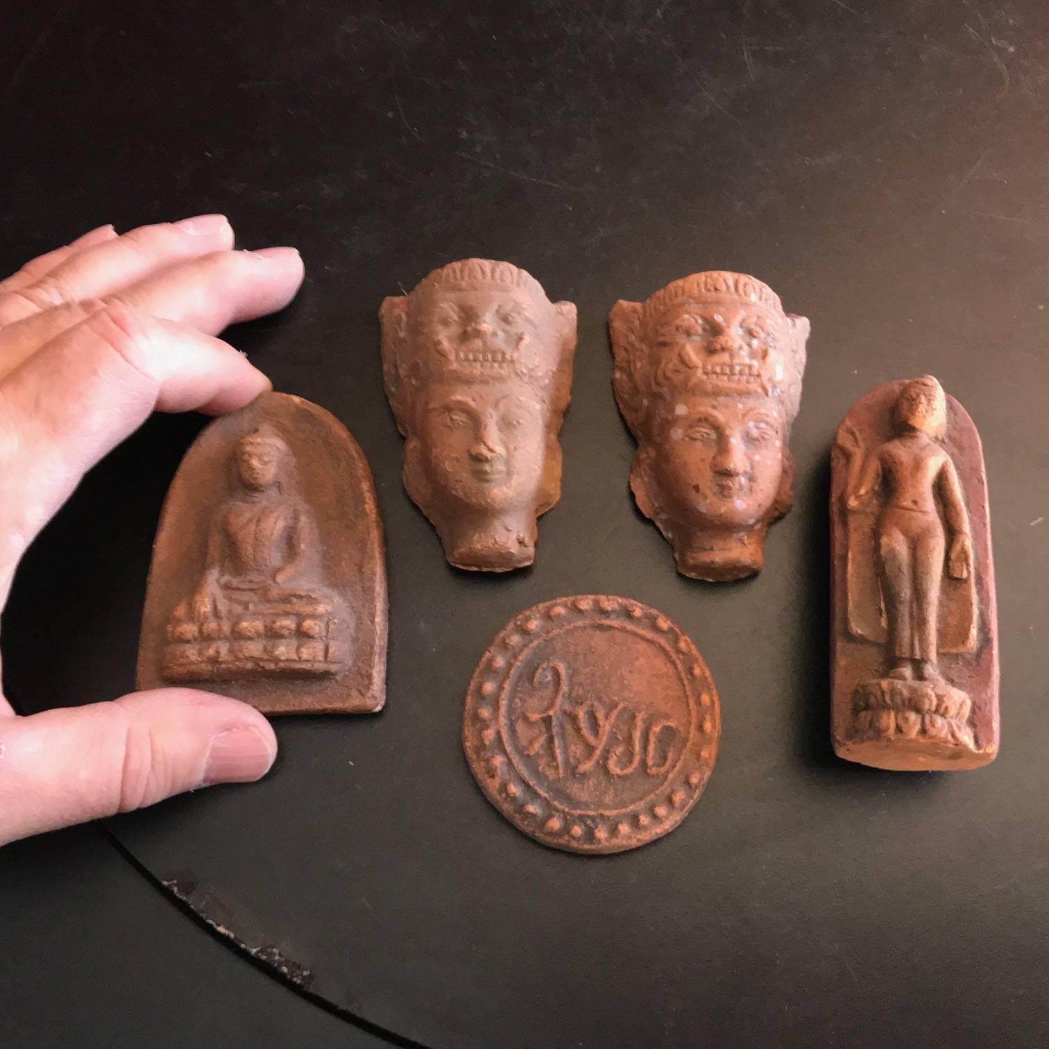 Myanmar, Burma, a one of a kind collection of five old Buddhist prayer offering votive sculptures dating to the early part of the last century.

Clay votive tablets of the Buddha and Buddhist images represent a significant element of the